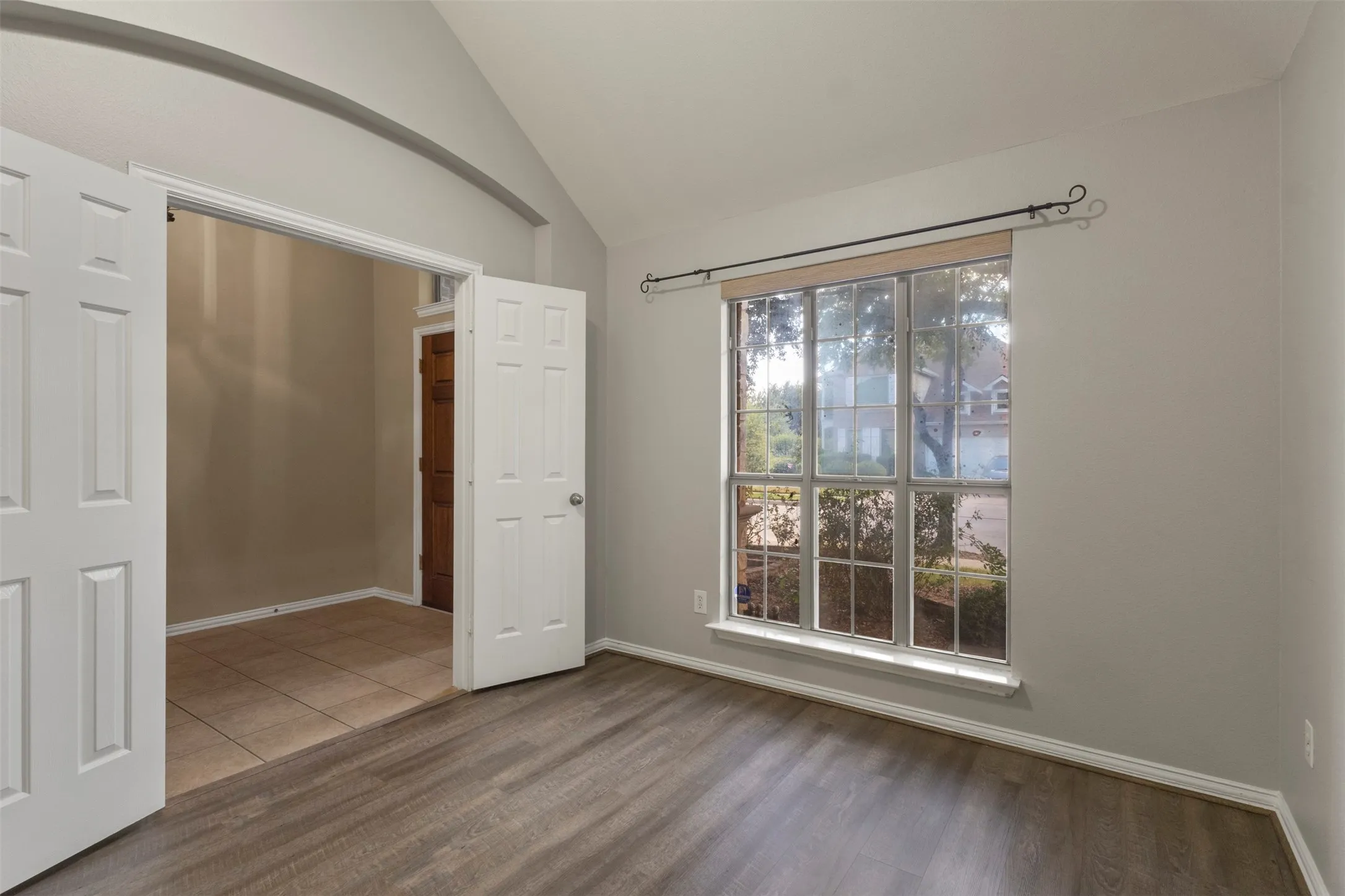 Vaulted ceiling and wood-finish flooring