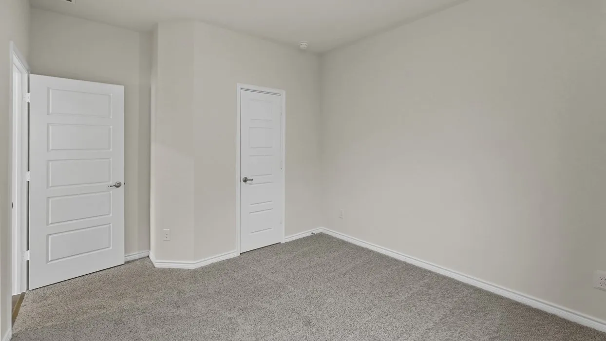 Light gray textured carpeting with white baseboards