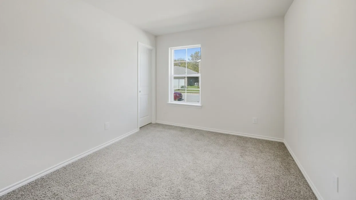 Room with light gray wall paint, gray carpet flooring, and a white-framed window