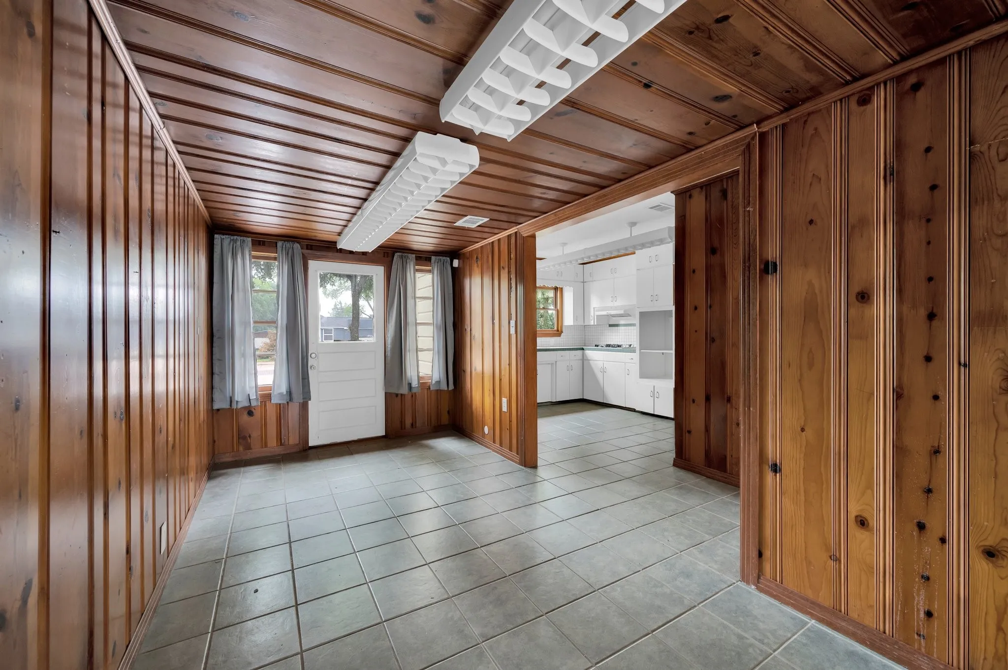 Wood-paneled walls and ceiling