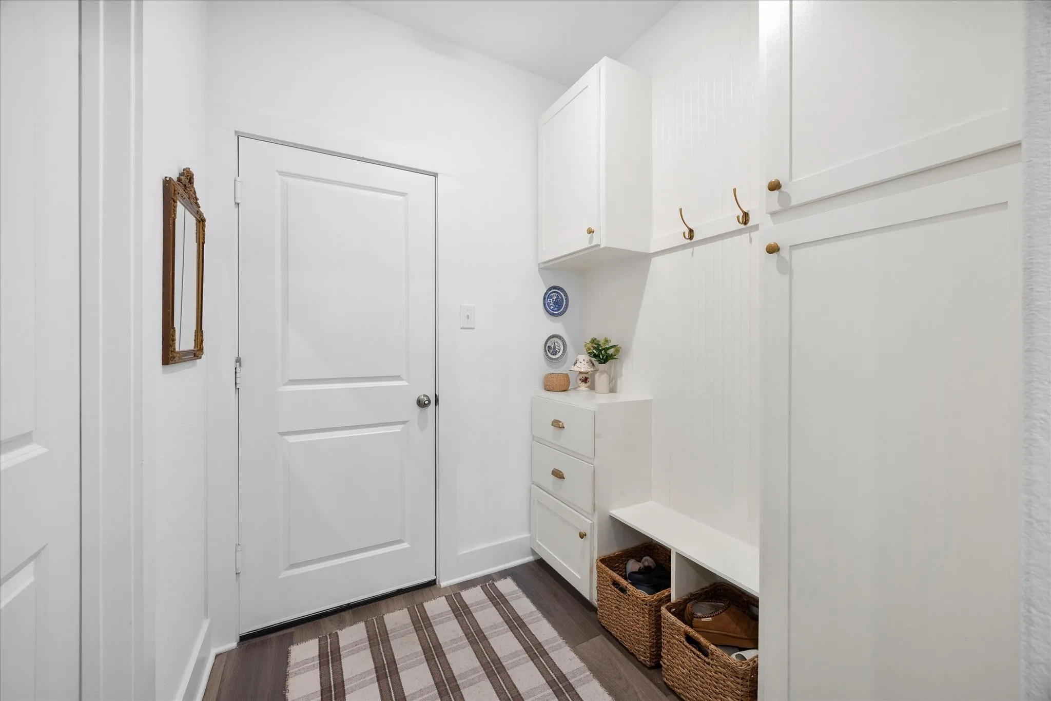 Custom built mudroom by pantry and garage entrance