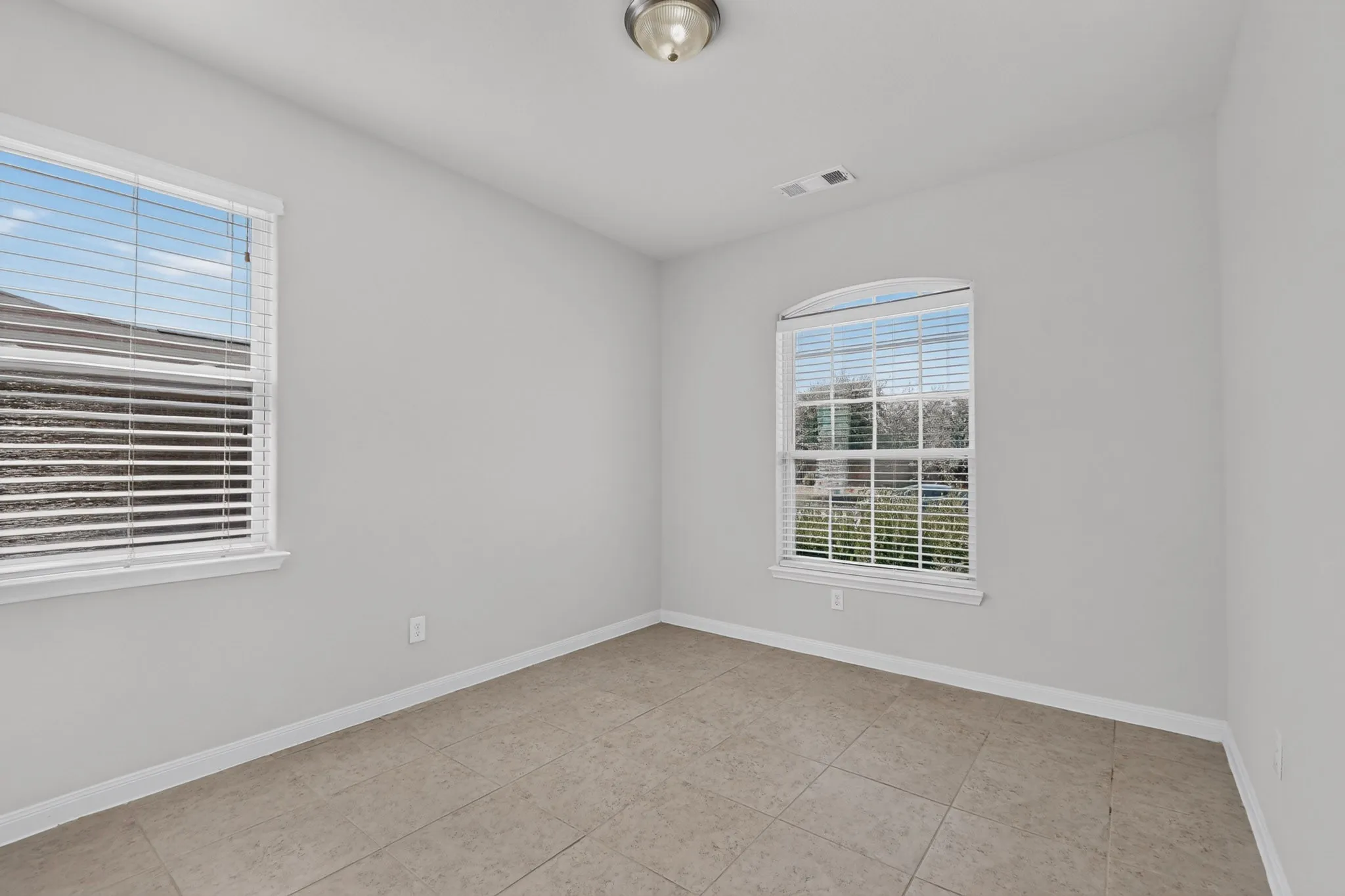 Neutral-toned walls paired with a tile floor