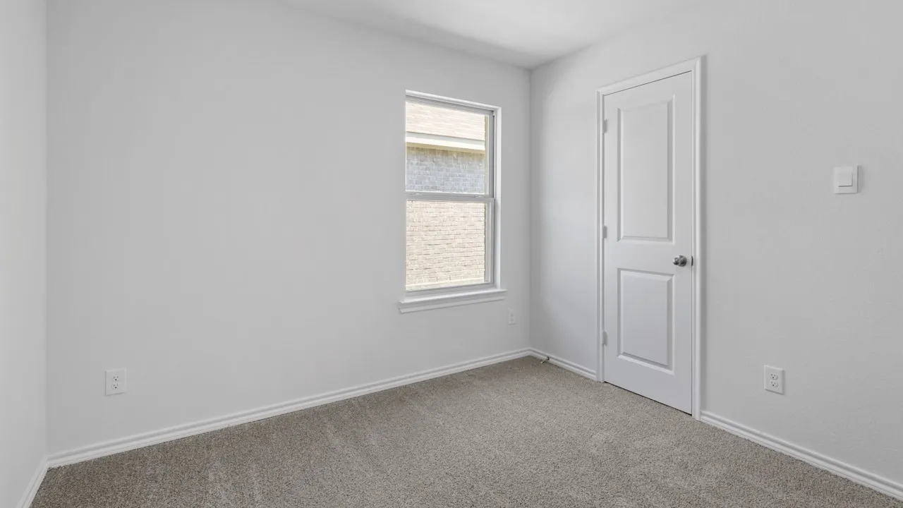 Room featuring neutral gray carpeting and white painted walls