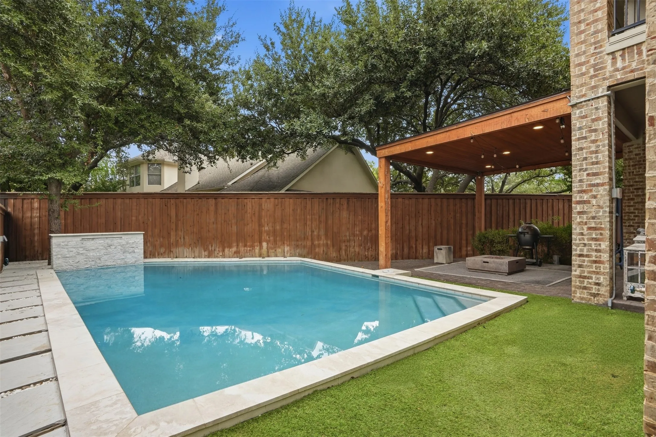 Heated pool directly off the covered patio