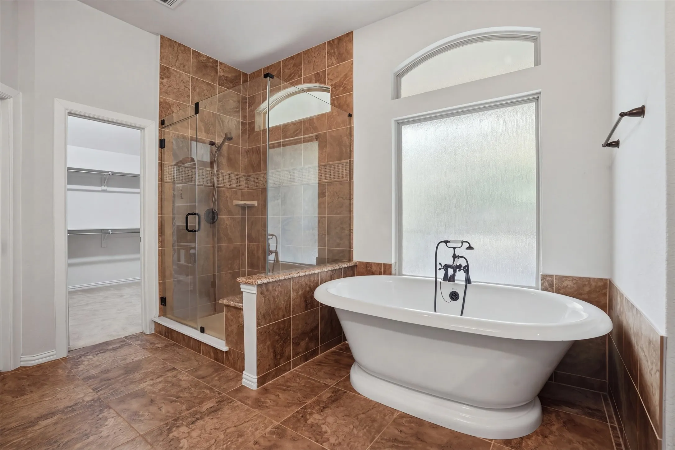 Primary bath leading straight into the closet