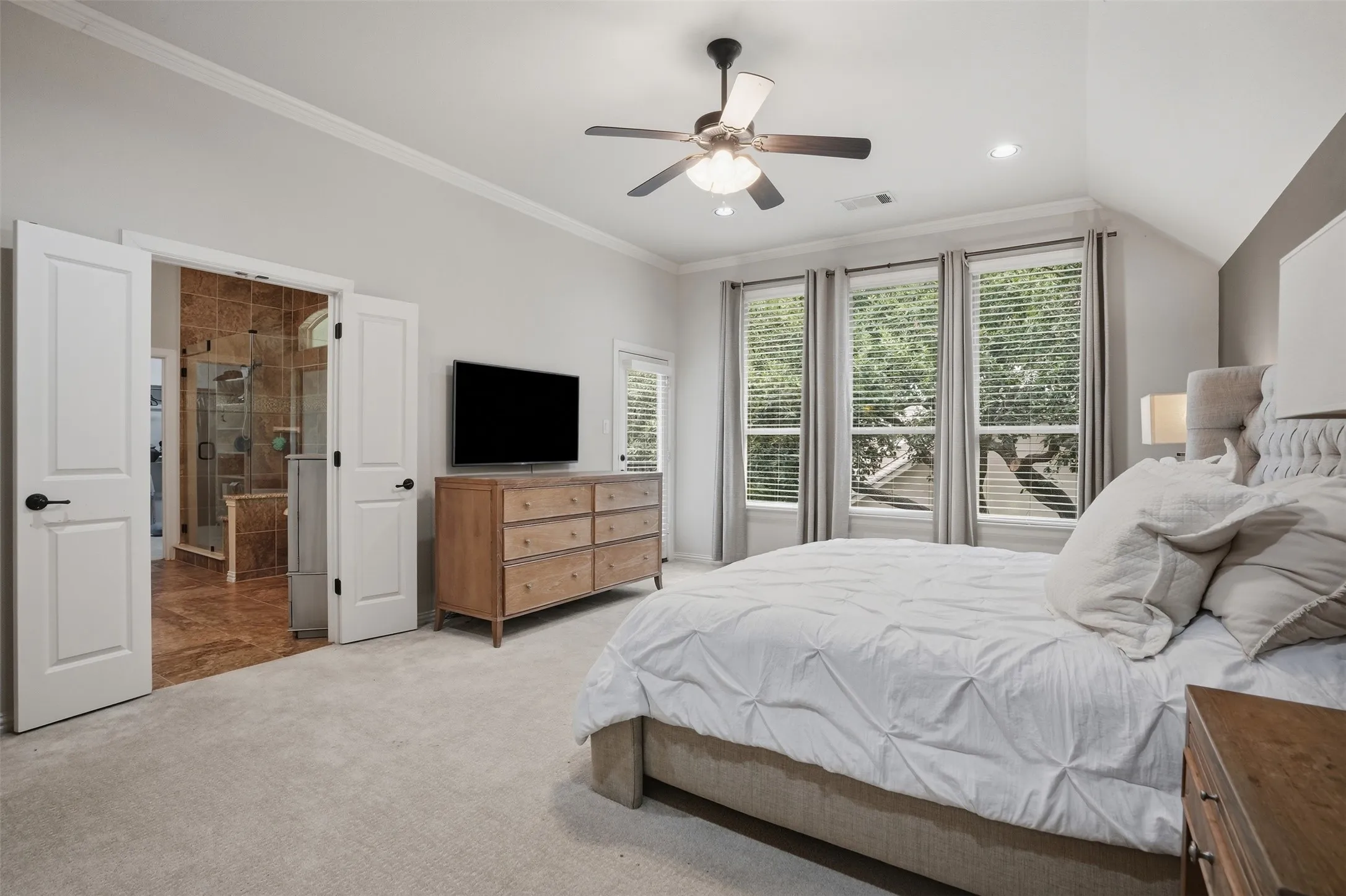 Upstairs primary suite with backyard and pool views & a private balcony overlooking them as well