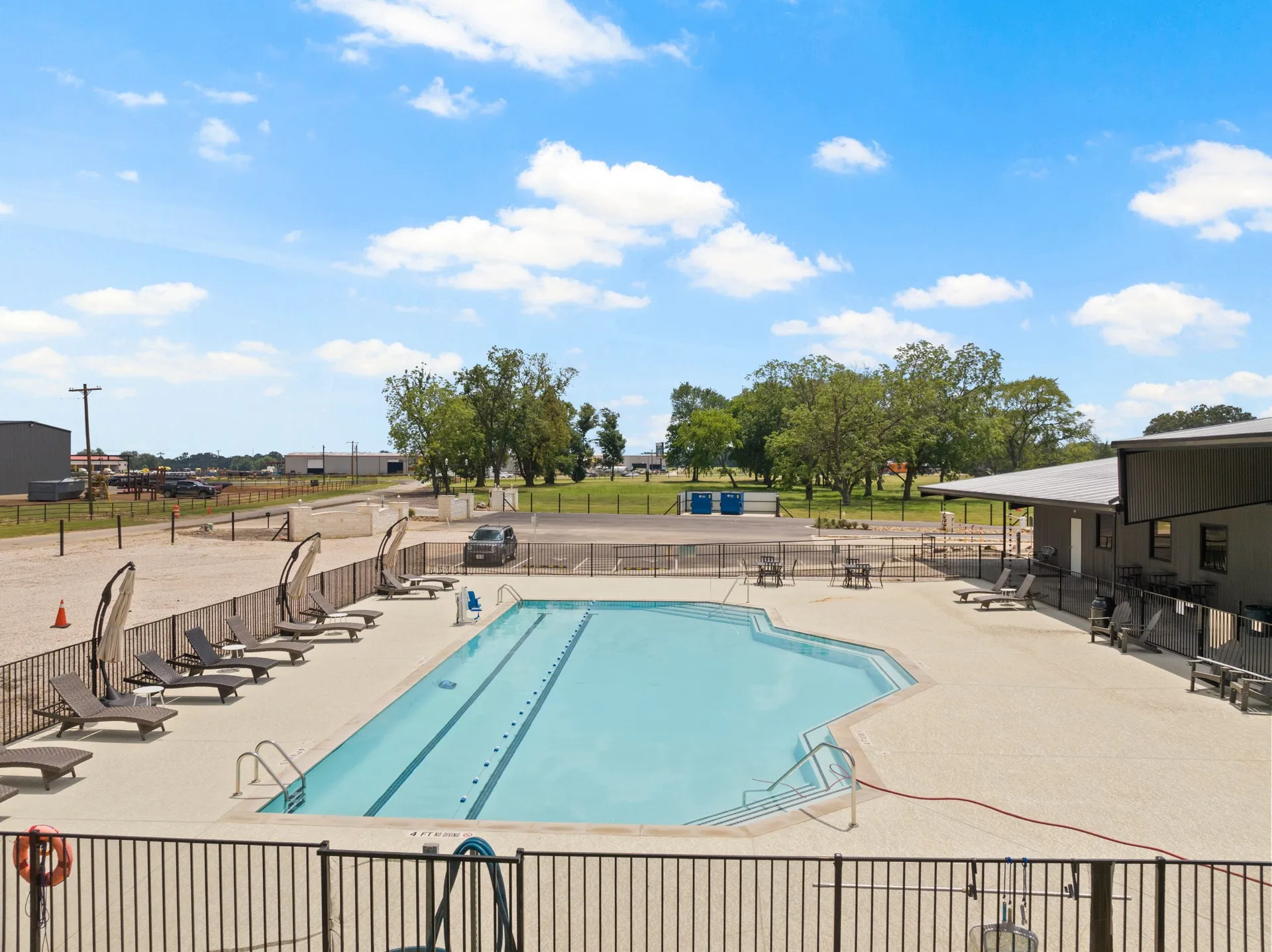 Community pool featuring a patio