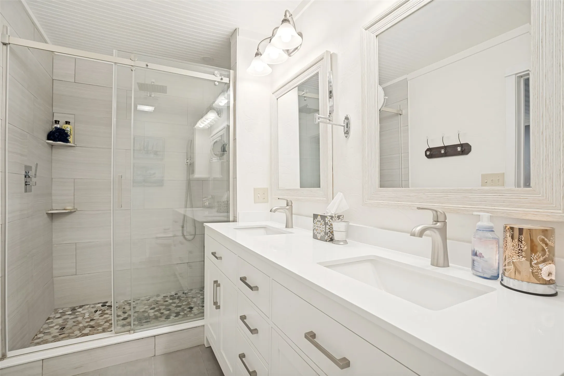 Dual vanity with undermount sinks and modern brushed nickel faucets
