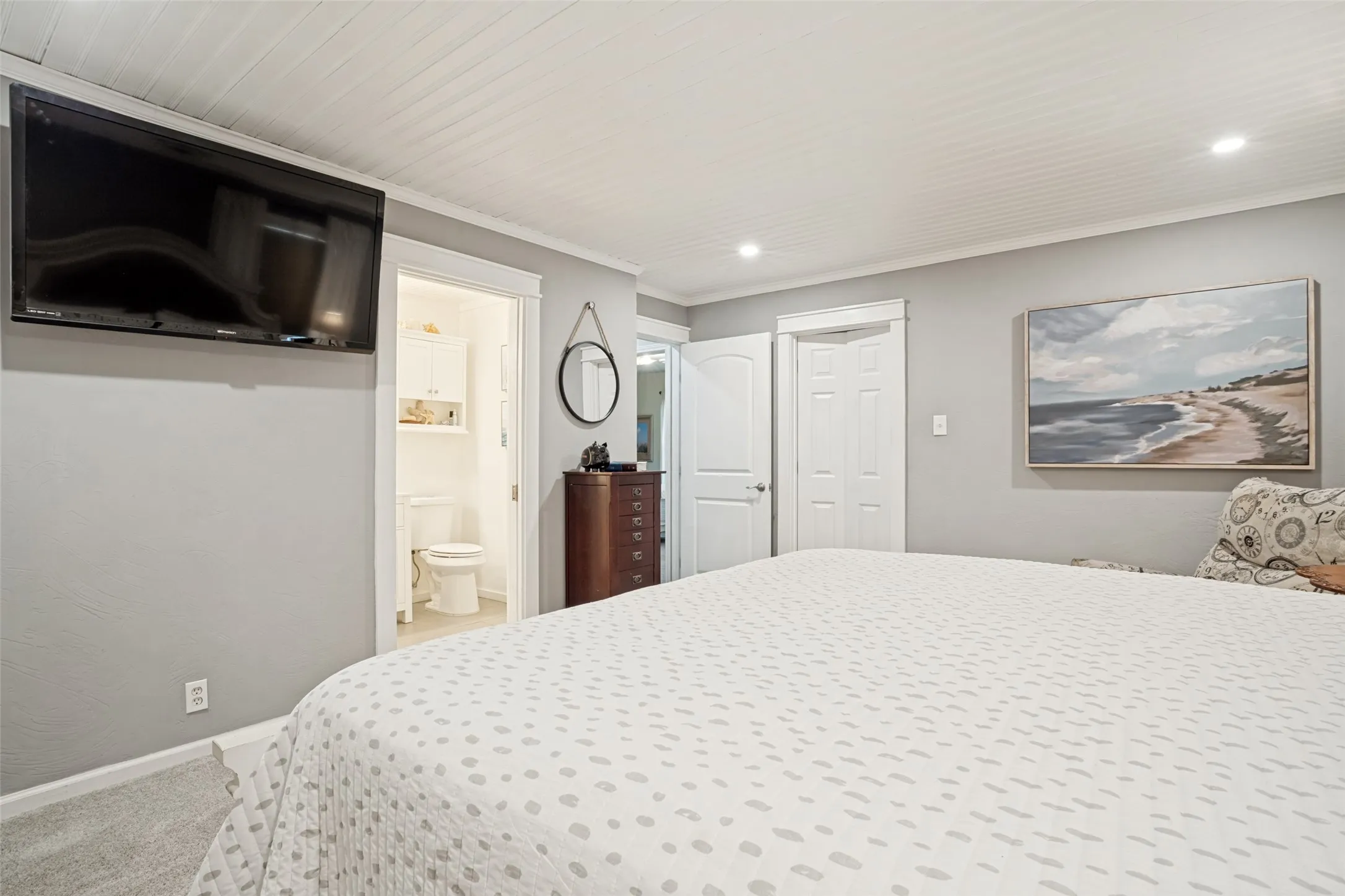 Recessed lighting, light gray wall finish, white trim, and white tongue and groove ceiling