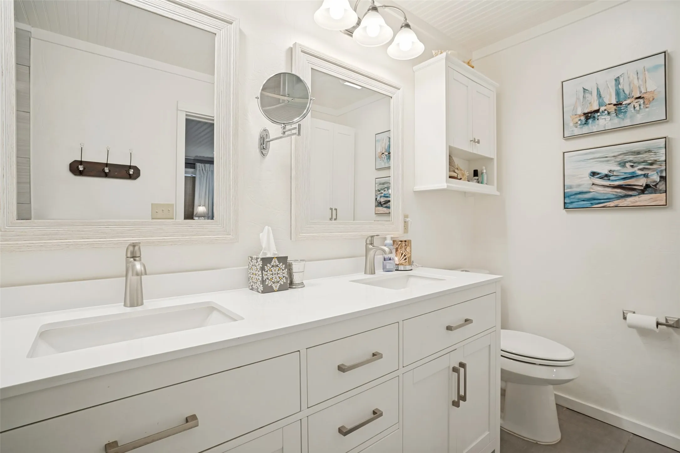 Dual vanity featuring integrated sinks and brushed nickel faucets