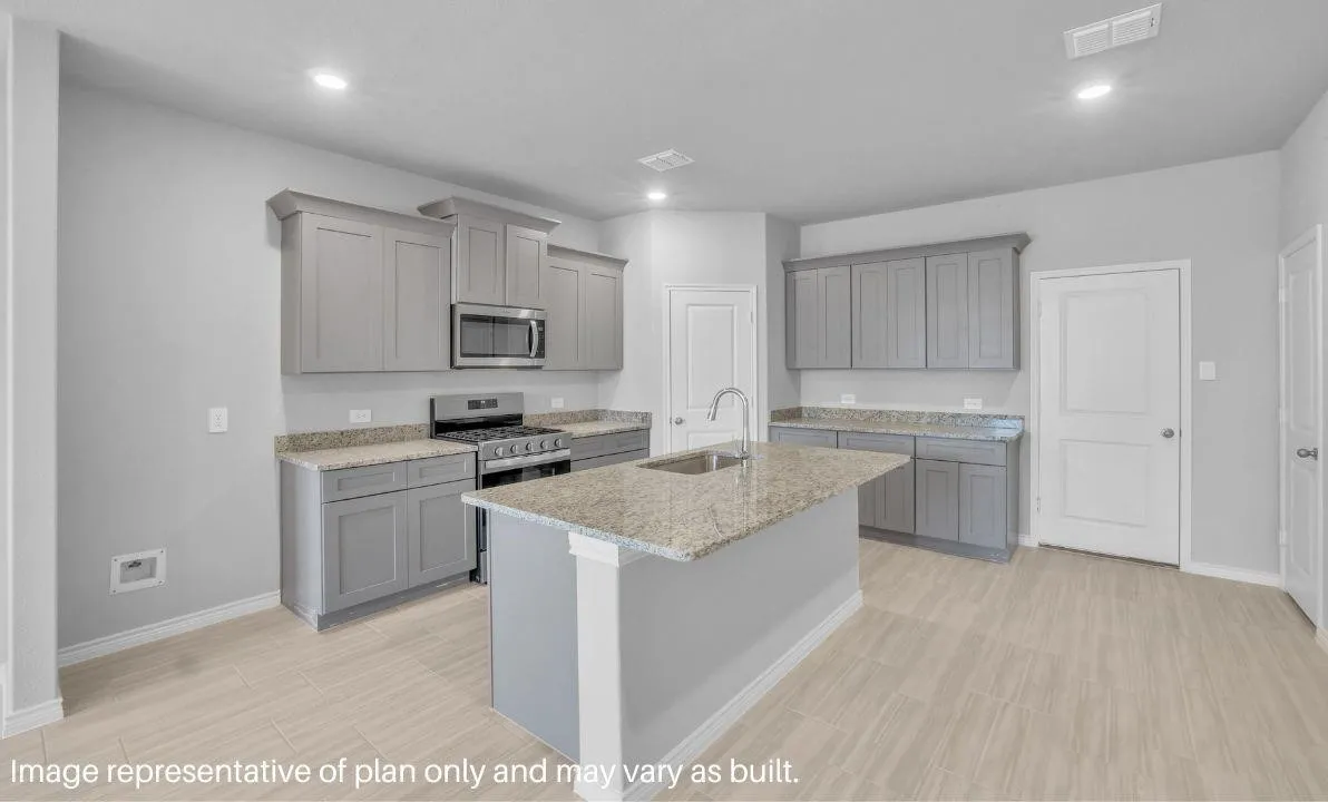 Central island with an undermount sink, granite-style countertops, gray cabinetry, stainless steel range, and wood-finish flooring