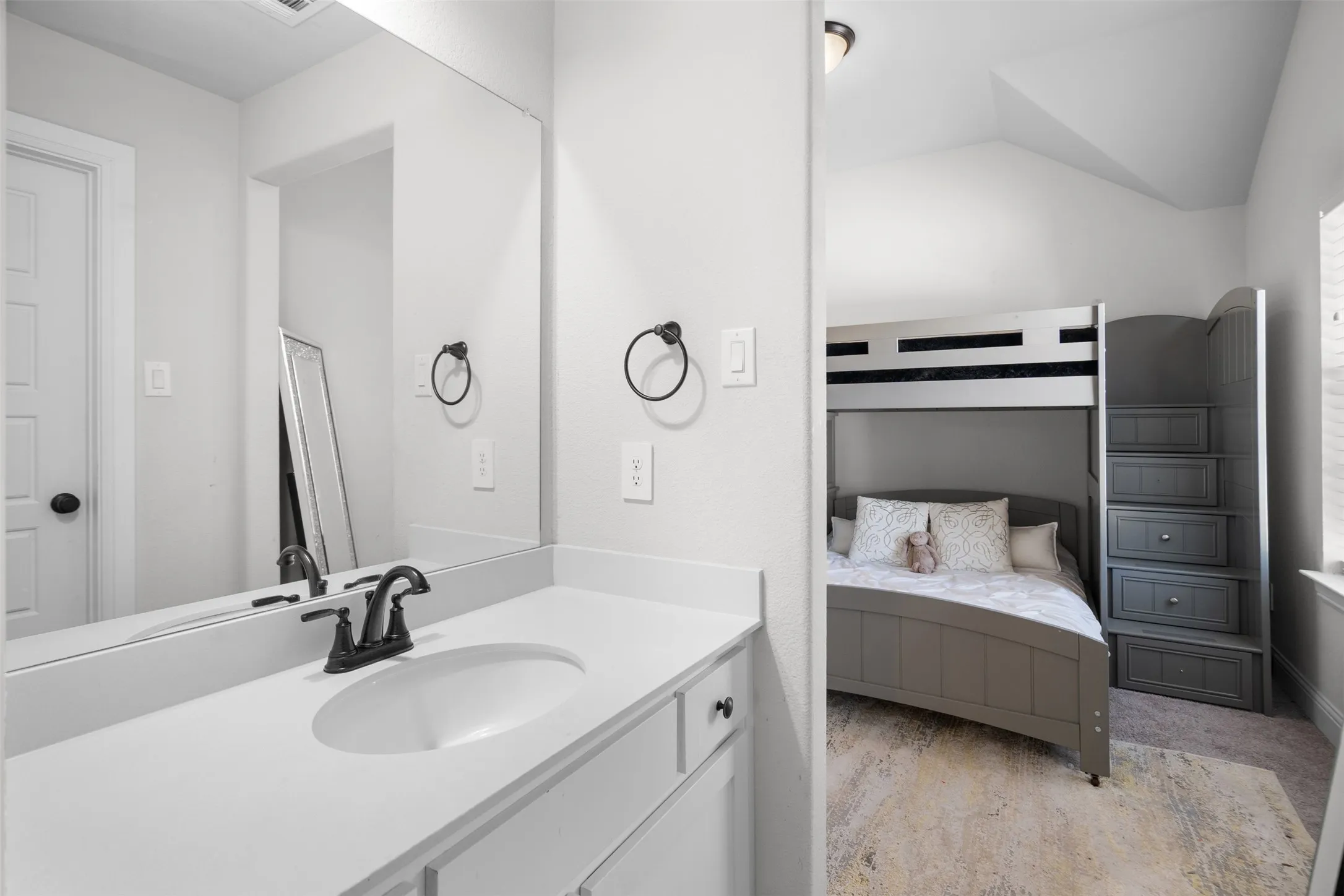 Vanity with integrated sink and matte black faucet