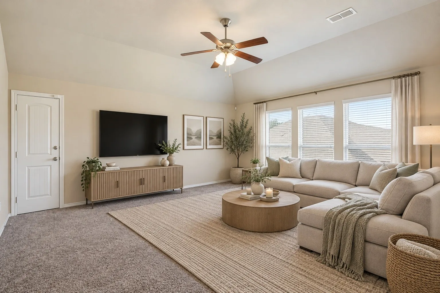 Virtually staged family room with a clean, bright, and inviting design that highlights the space’s open and comfortable feel.