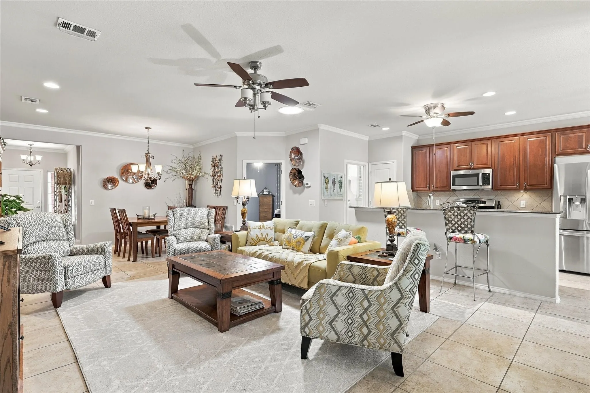 Living Room opens to Dining Room and Kitchen