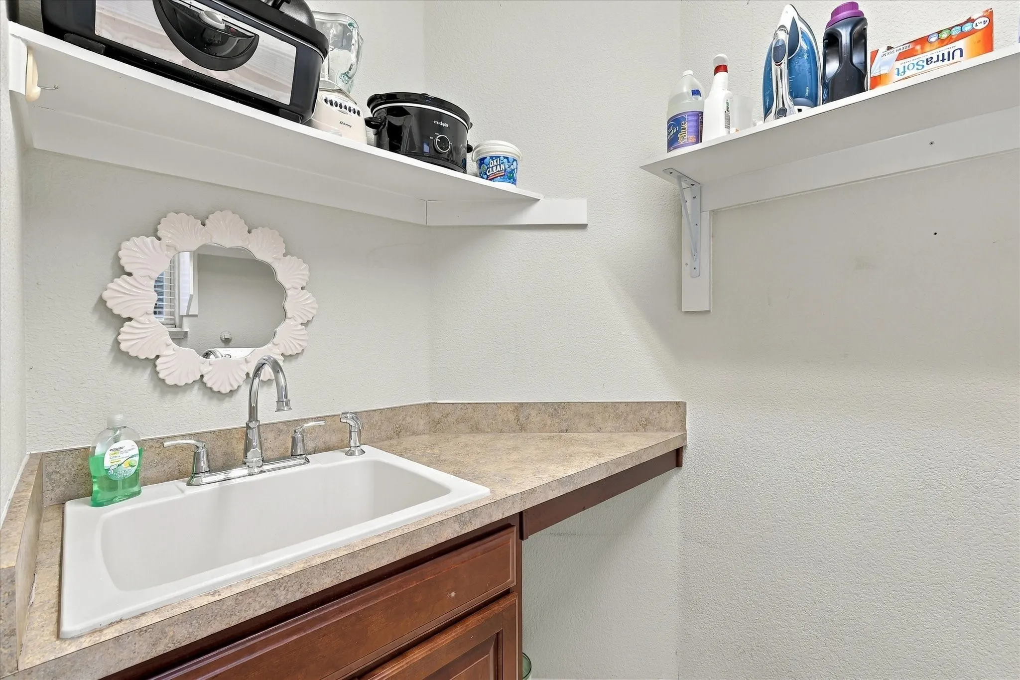Utility Room with a sink and built in cabinets