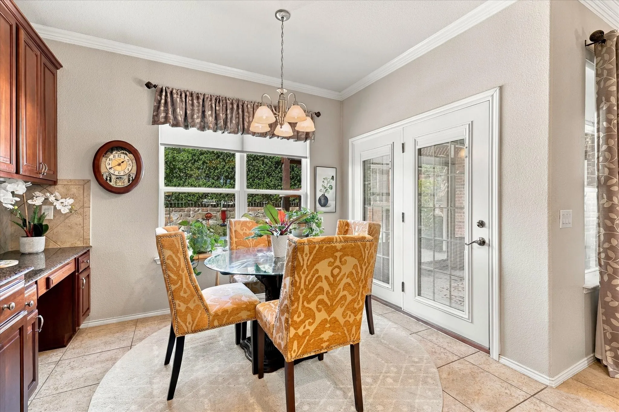 Breakfast Area has a beautiful view of Landscaped Backyard and opens to Screened Patio