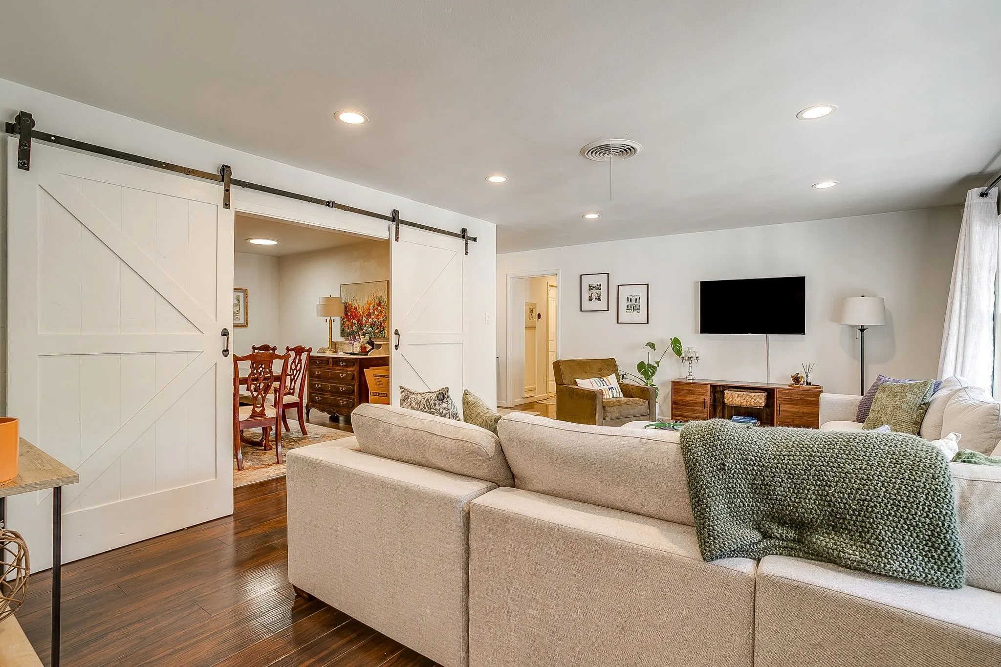 White barn doors on a black rail system