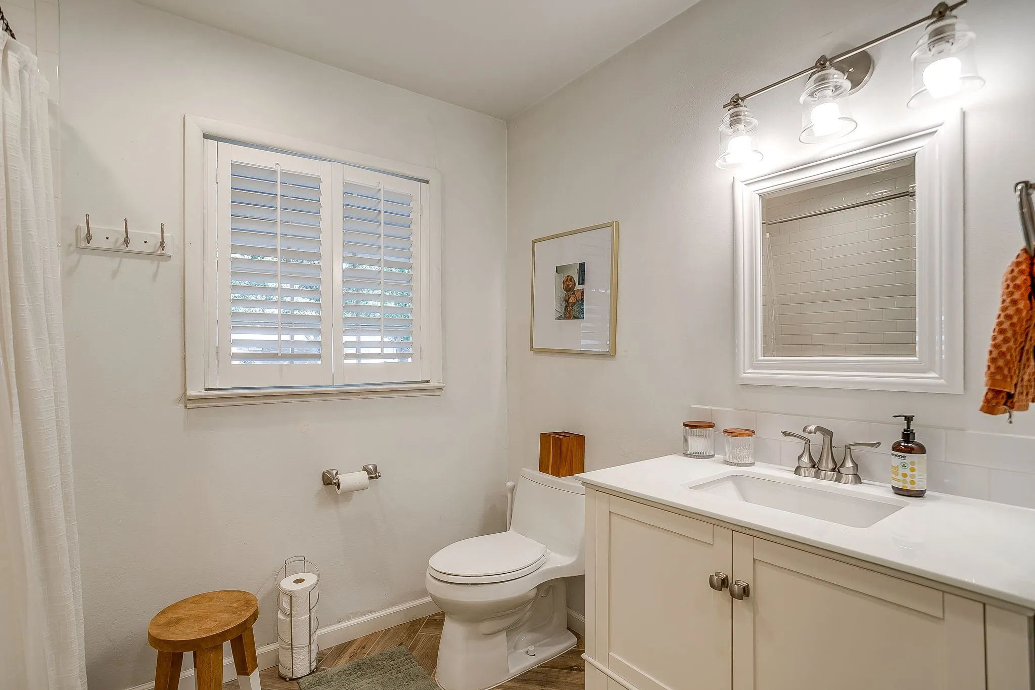 White shaker vanity with integrated sink, white quartz countertop, and brushed nickel faucet
