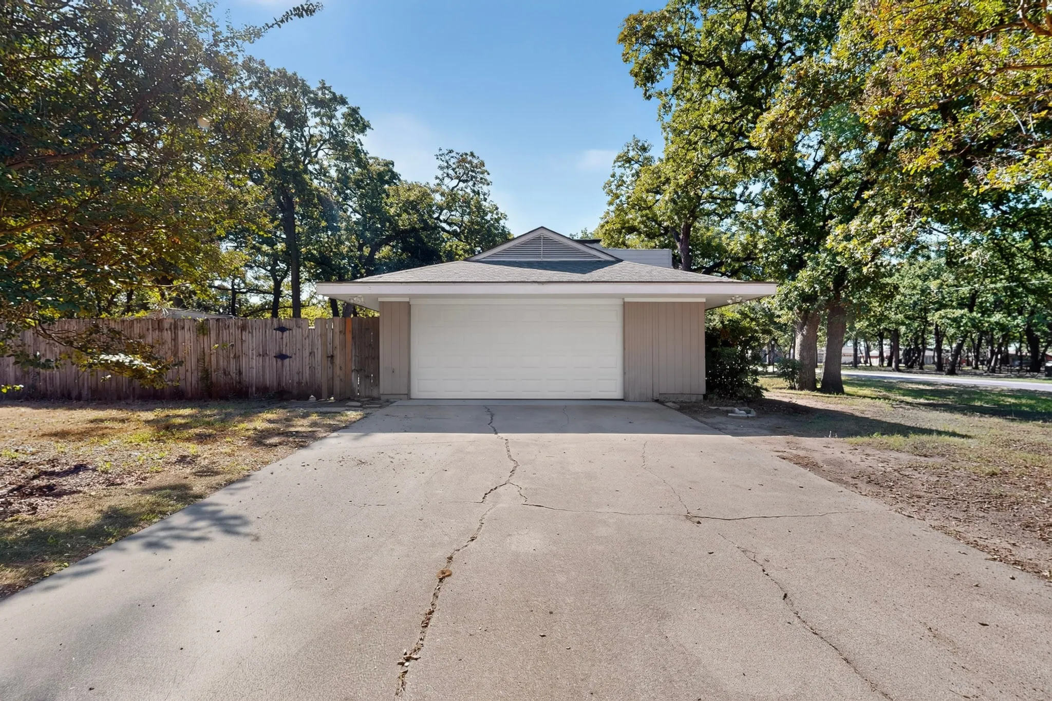 Attached garage with a white overhead door
