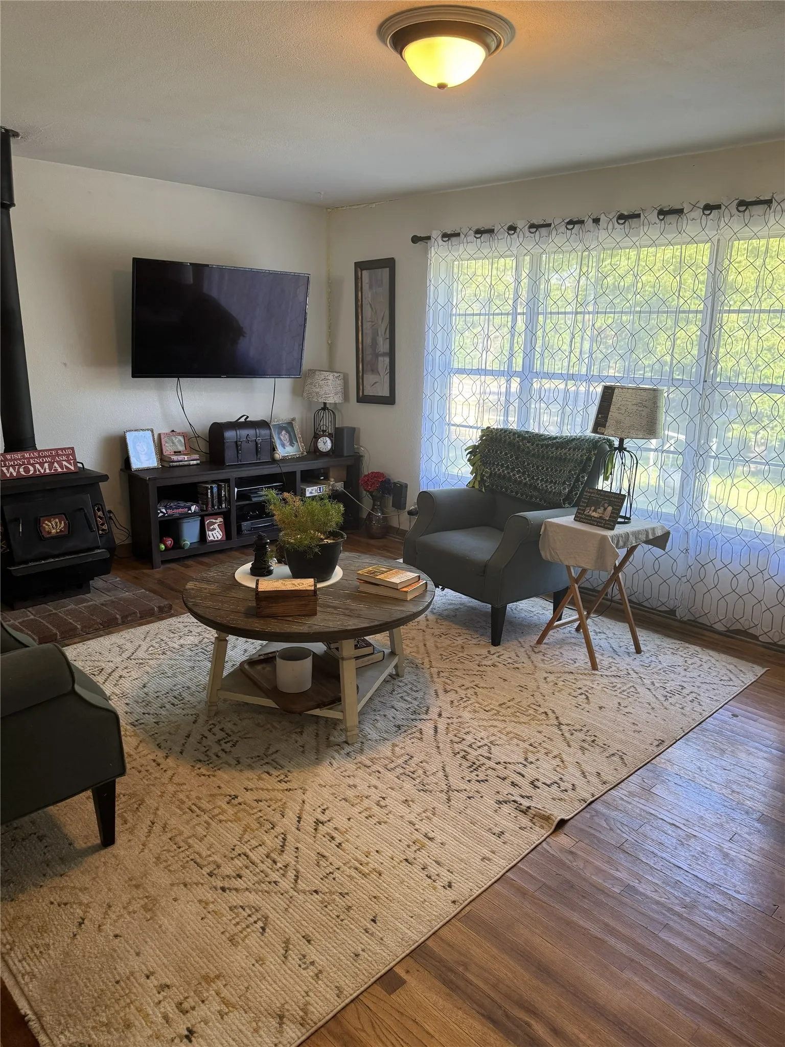 Wood-finish flooring throughout the room