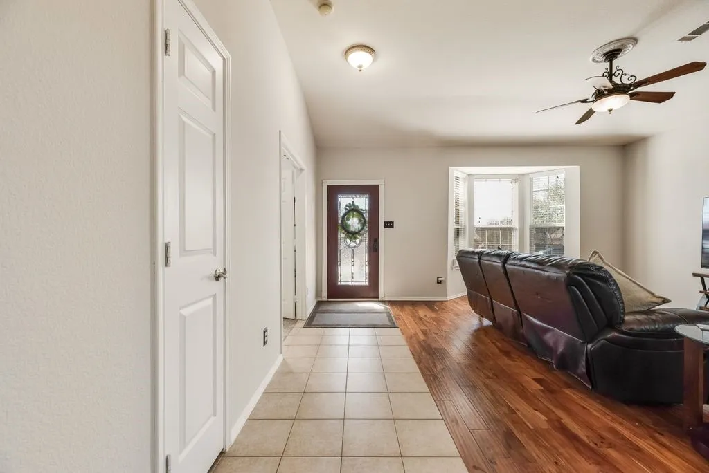 Recessed lighting, bay window, wood-finish flooring, tile flooring, ceiling fan