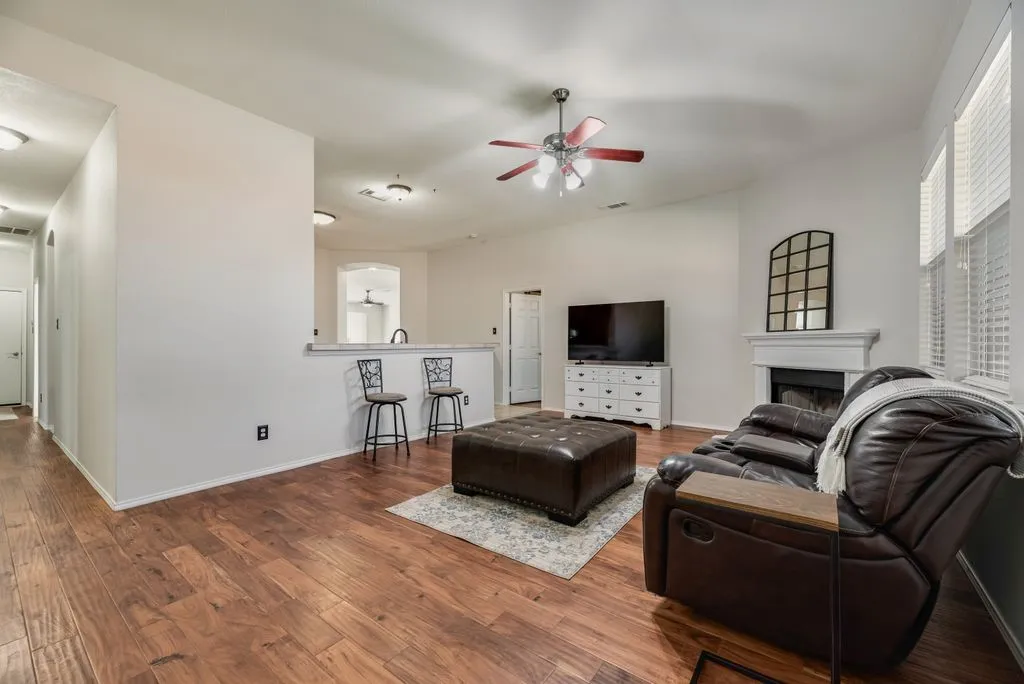 Wood-finish flooring, vaulted ceilings, and a ceiling fan