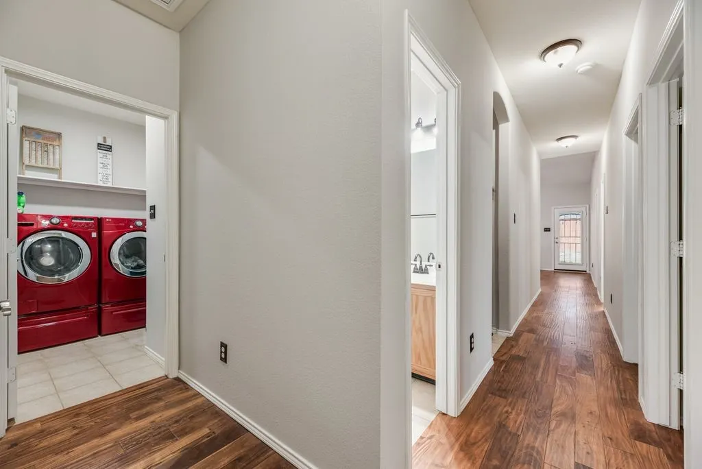 Hallway with wood-finish flooring, recessed lighting, and white trim