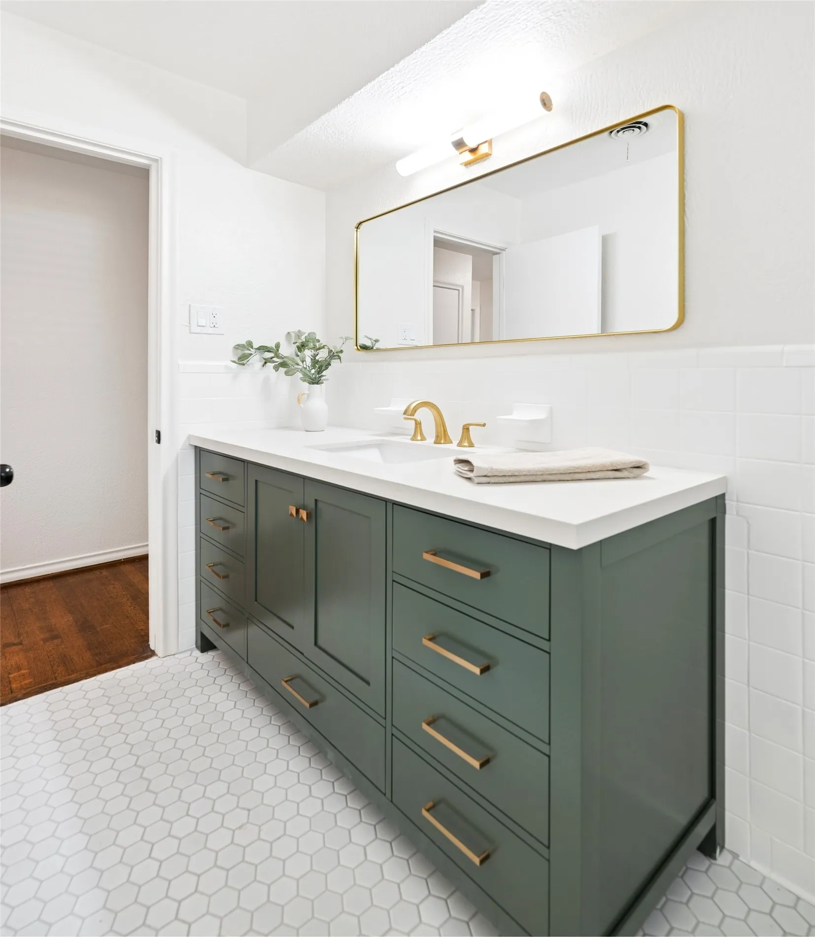 New vanity, flooring, mirror, lighting.