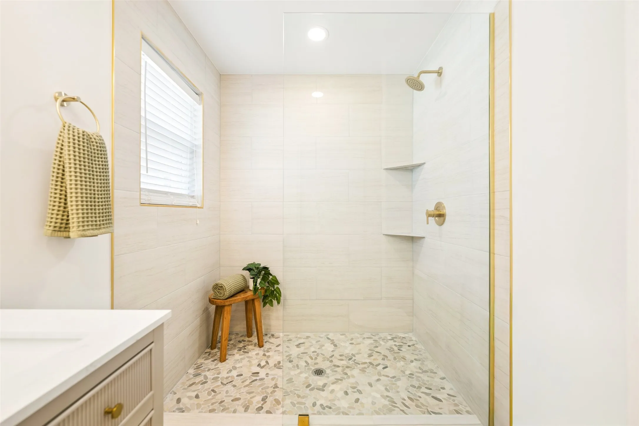 New shower, tile and glass door.