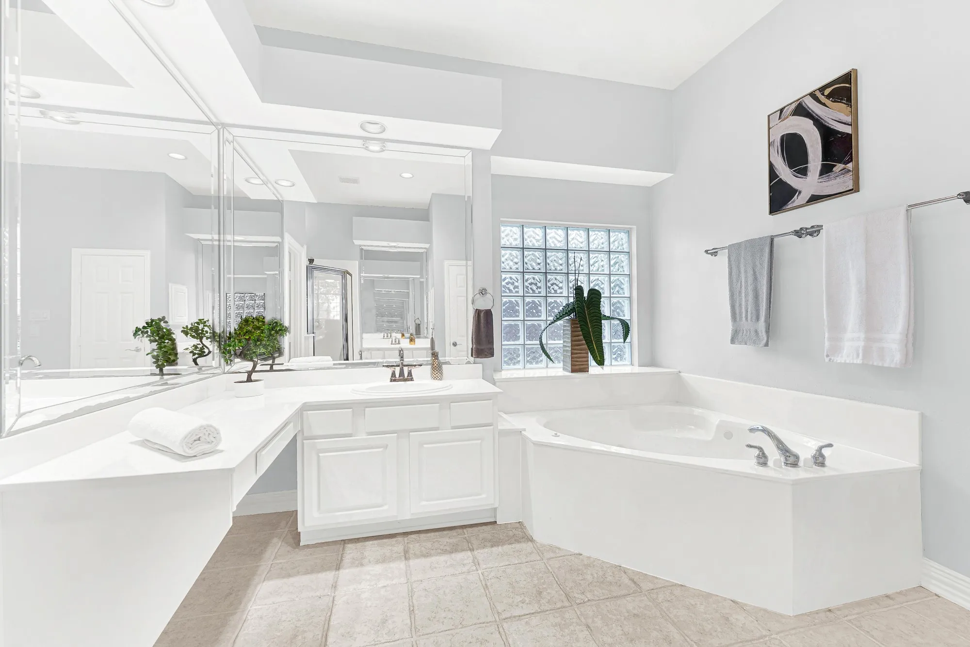 Primary bathroom features separate tub and shower