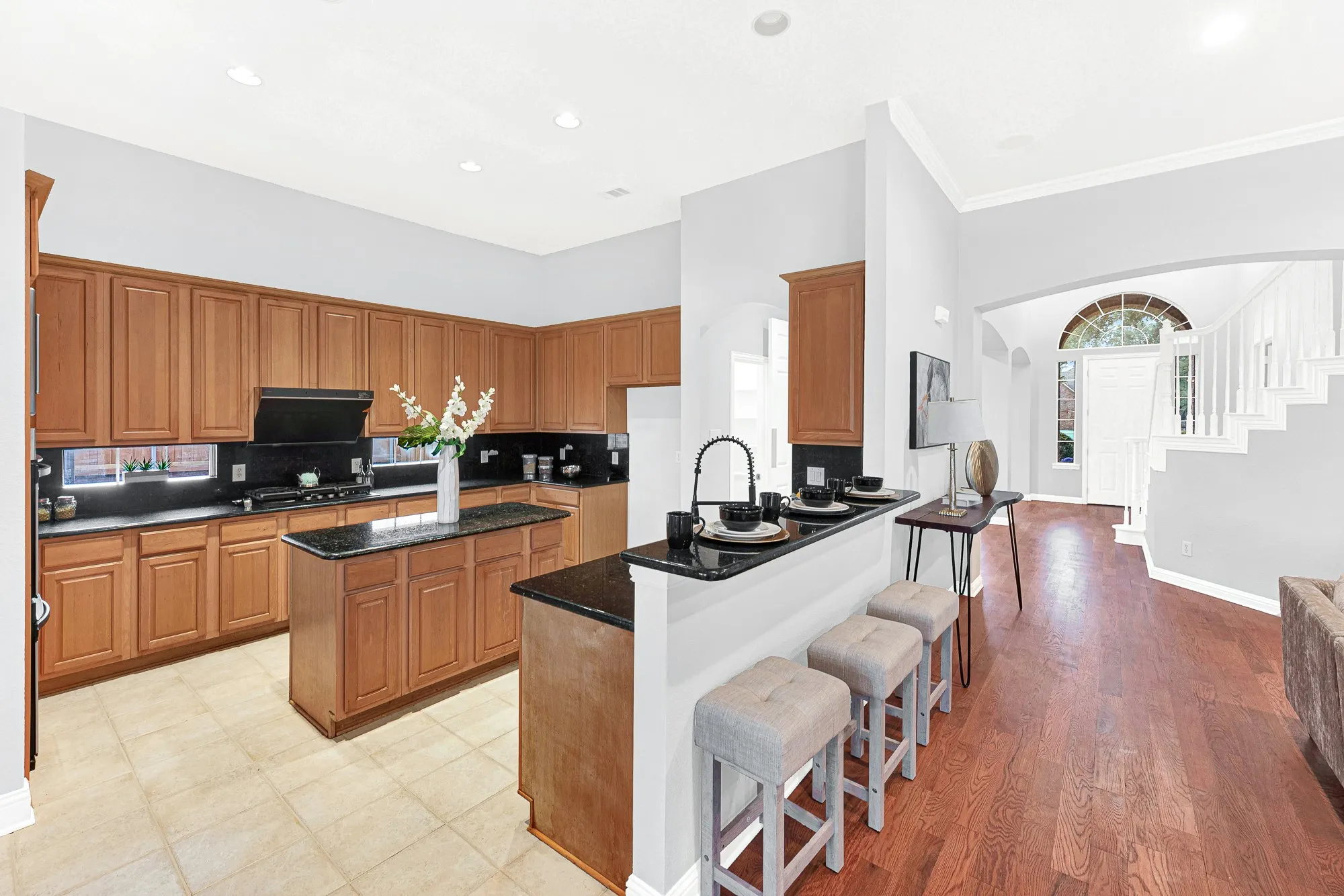 Kitchen offers plenty of cabinet and counter space, and a convenient breakfast bar