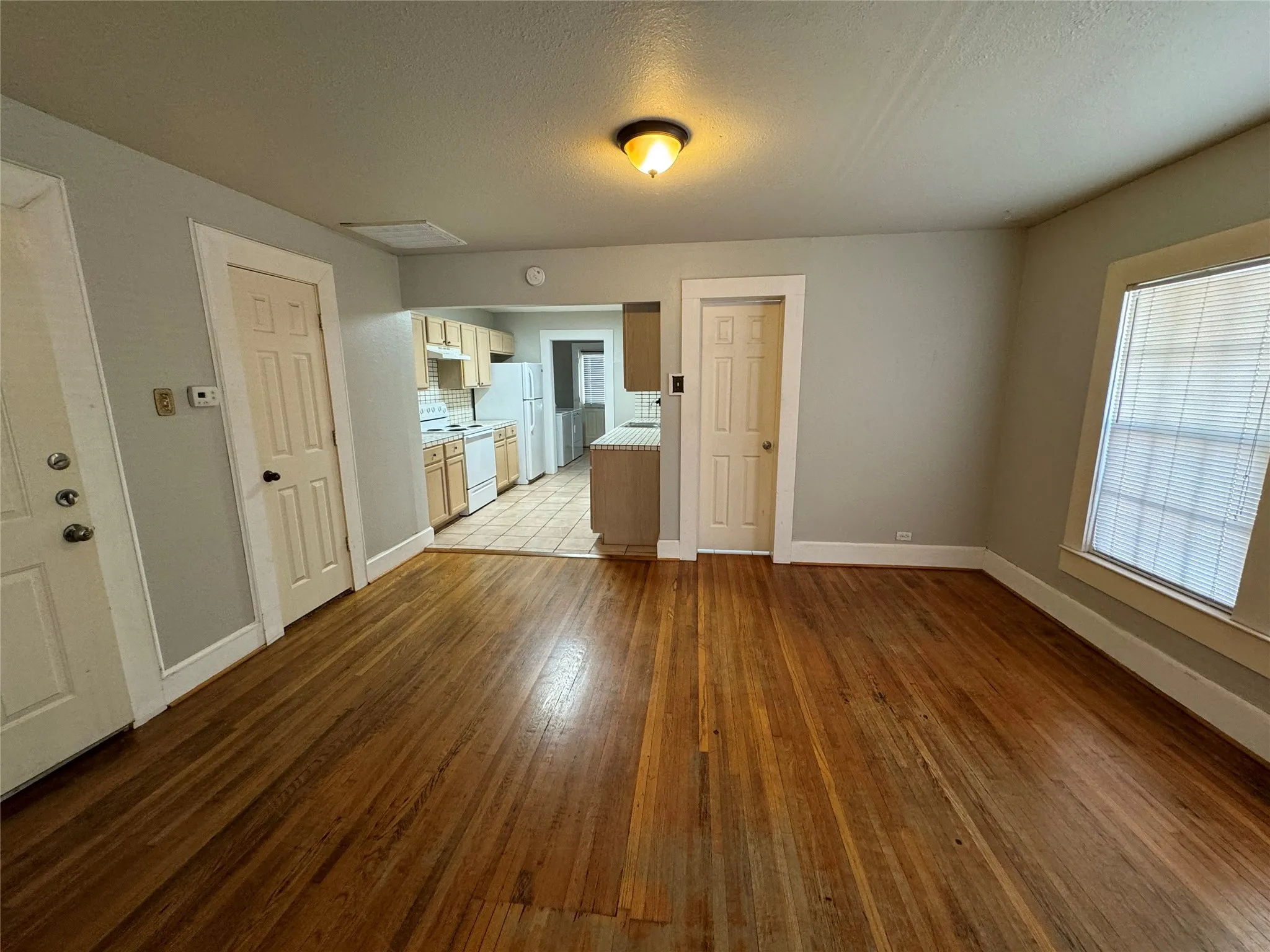 Spare room with a wealth of natural light and tile patterned flooring
