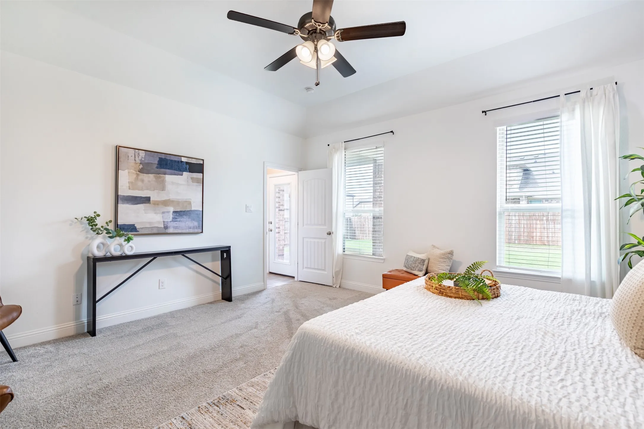 Main-level primary suite privately located at the rear of the home, offering convenient first-floor living.