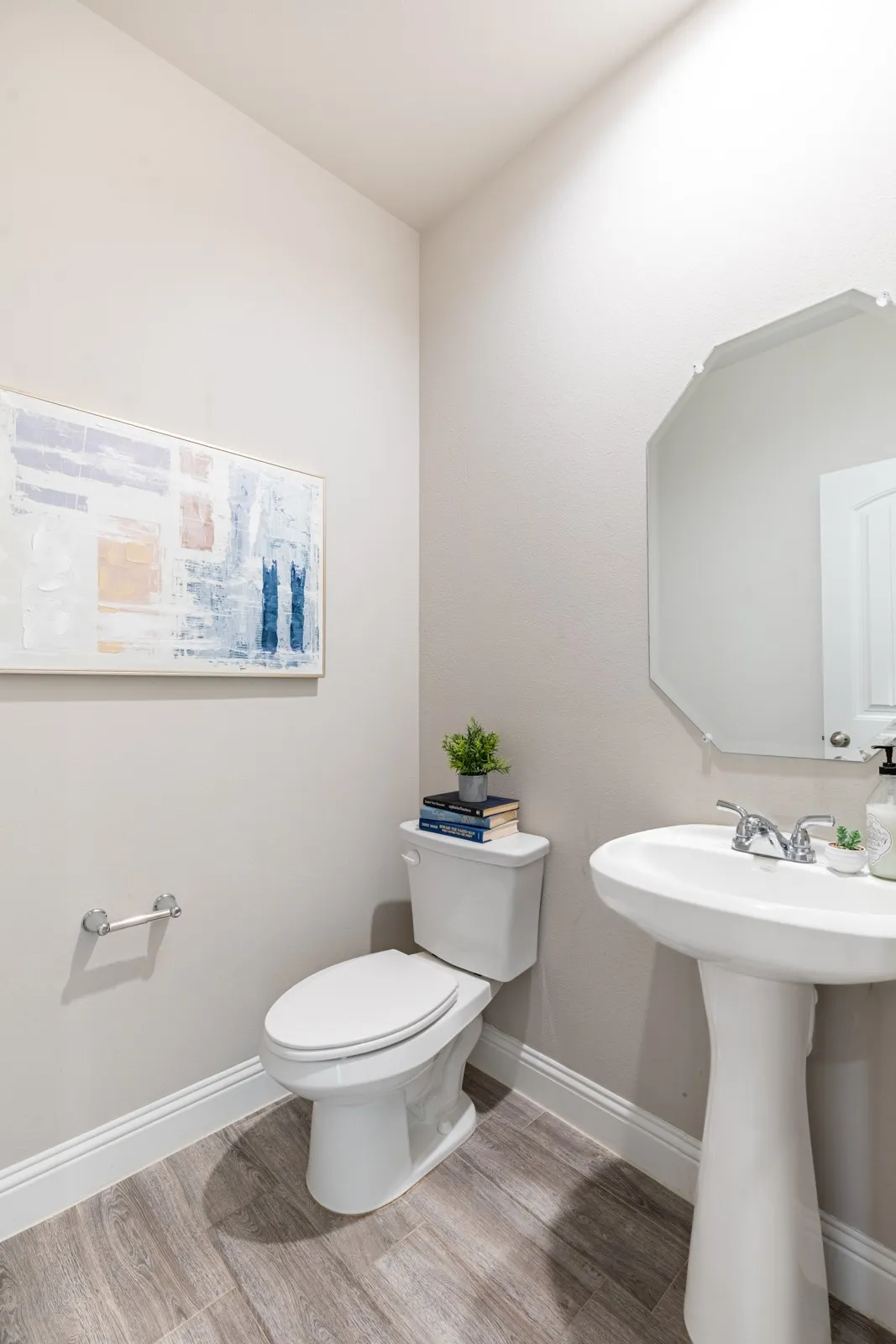 Convenient main-level powder room, ideally located off the living areas for easy access by guests.