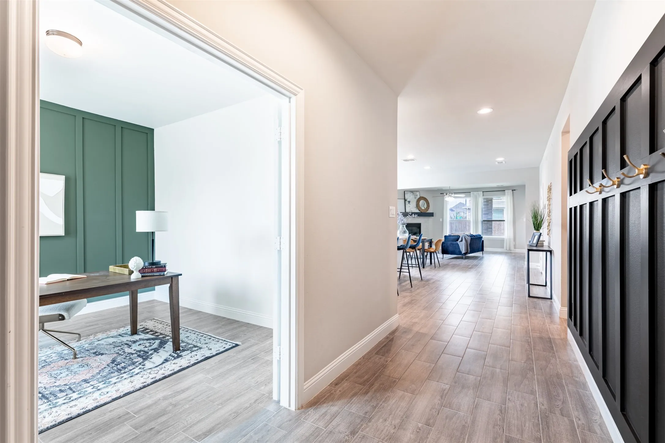 Dedicated home office just off the front entry, thoughtfully separated from the kitchen and main living spaces for a quiet, private workspace.