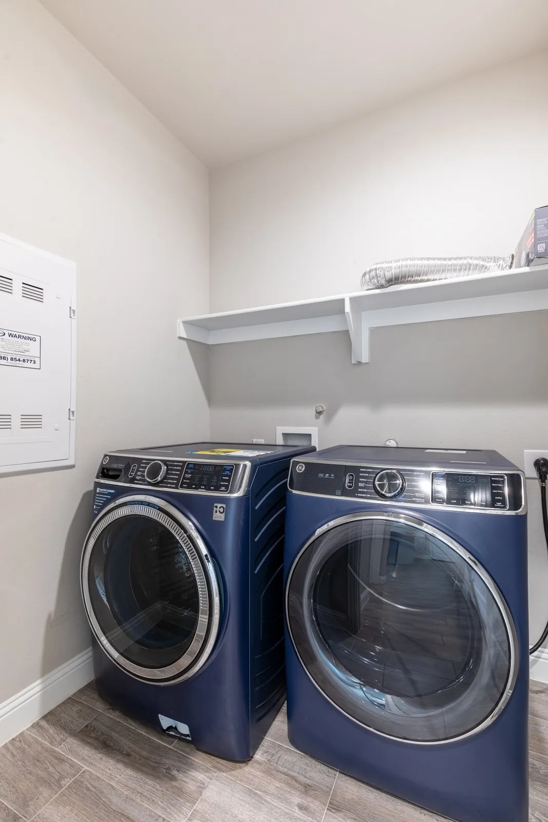 
Main-level laundry room with front-load washer and dryer, conveniently located for everyday living.