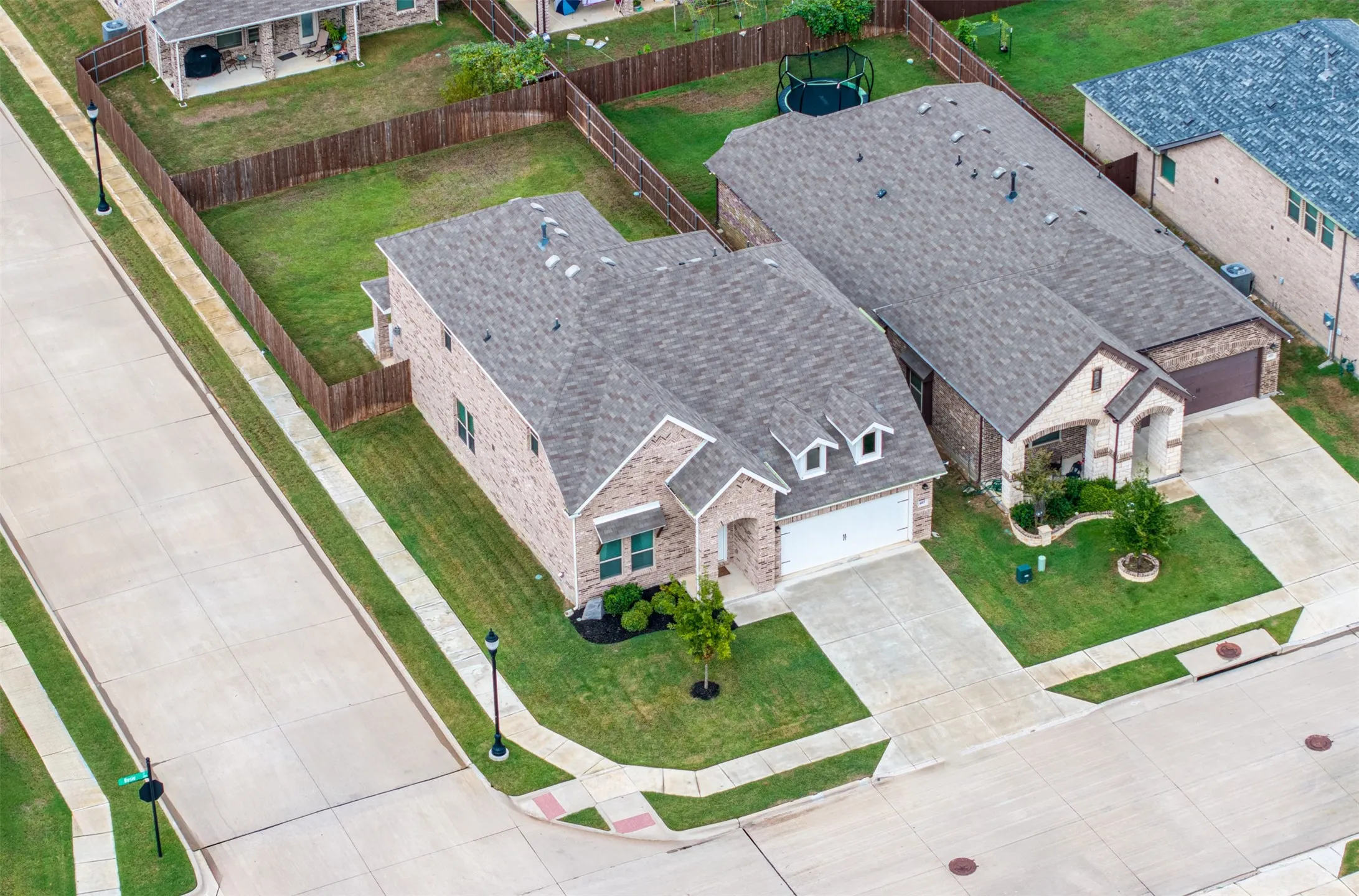 Aerial view of this Argyle ISD home showcasing its oversized corner lot, expansive backyard, spacious lot, and exceptional curb appeal.