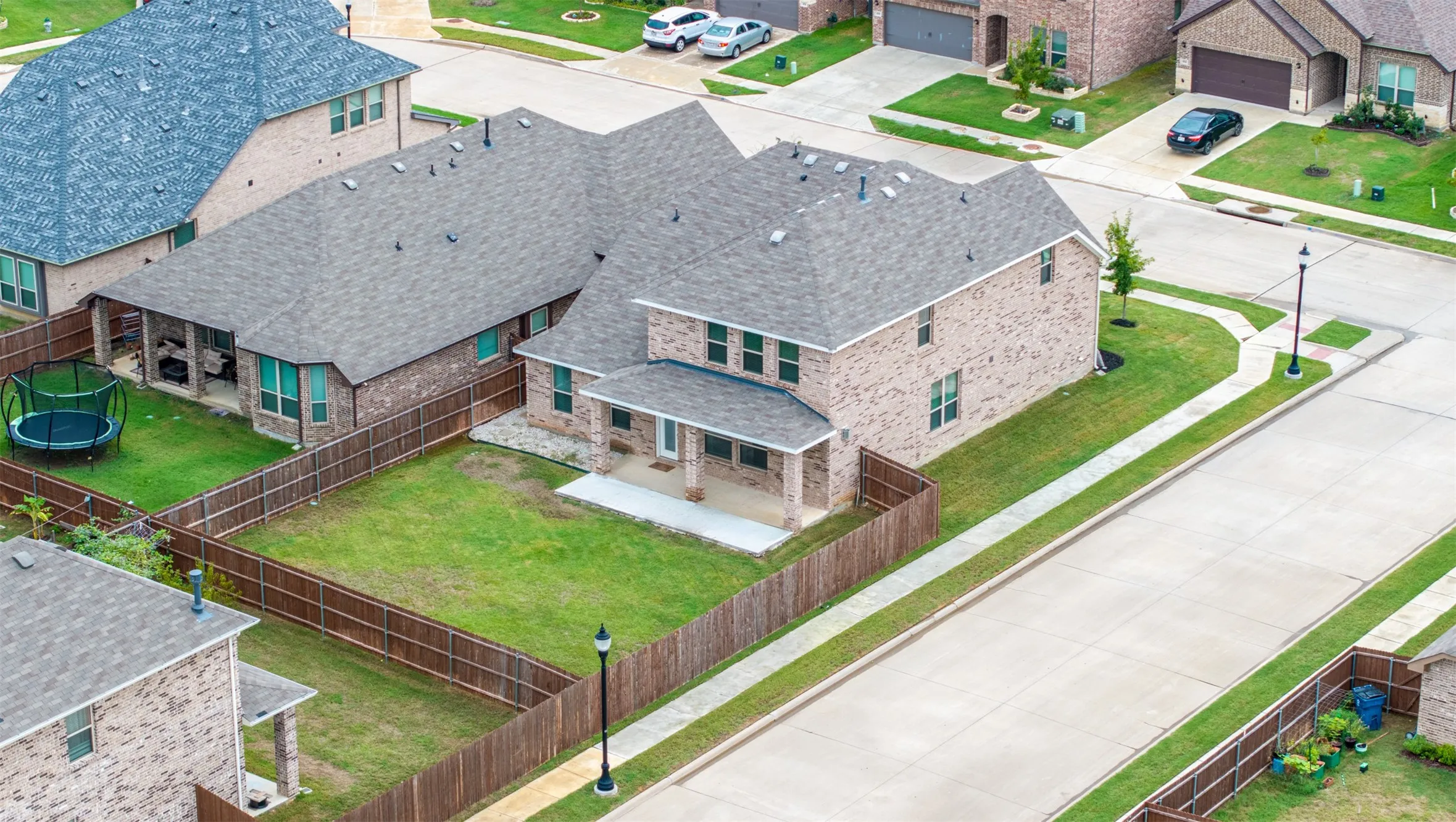 Aerial view of this Argyle ISD home showcasing its oversized corner lot, expansive backyard, spacious lot, and exceptional curb appeal.