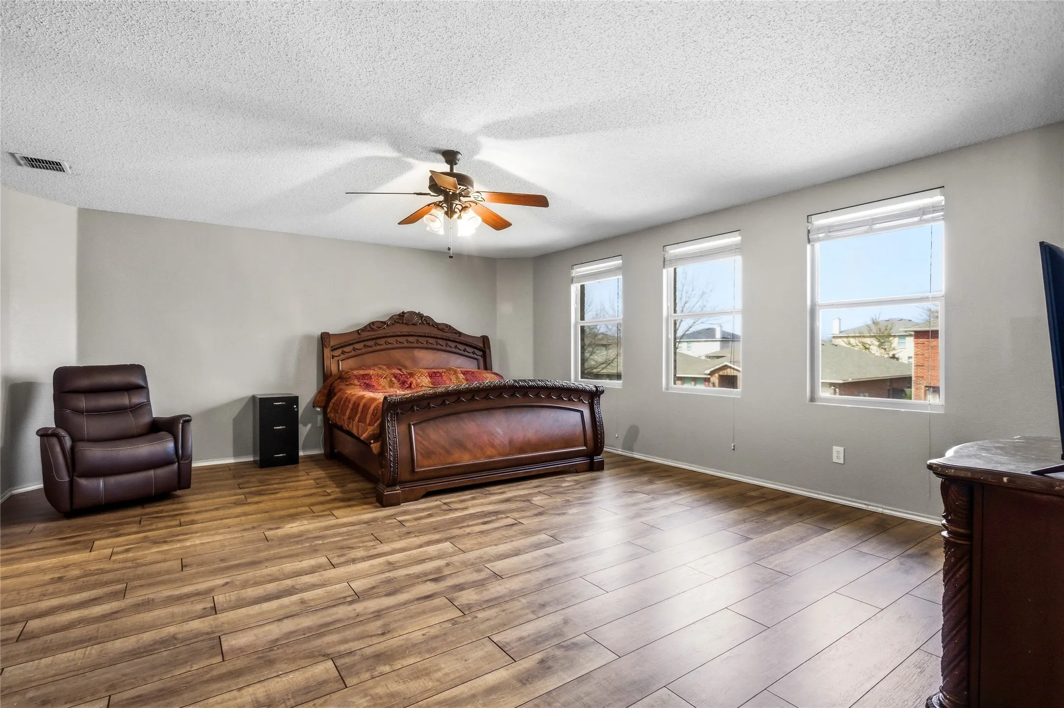 Large upstairs Primary bedroom, virtually enhanced.