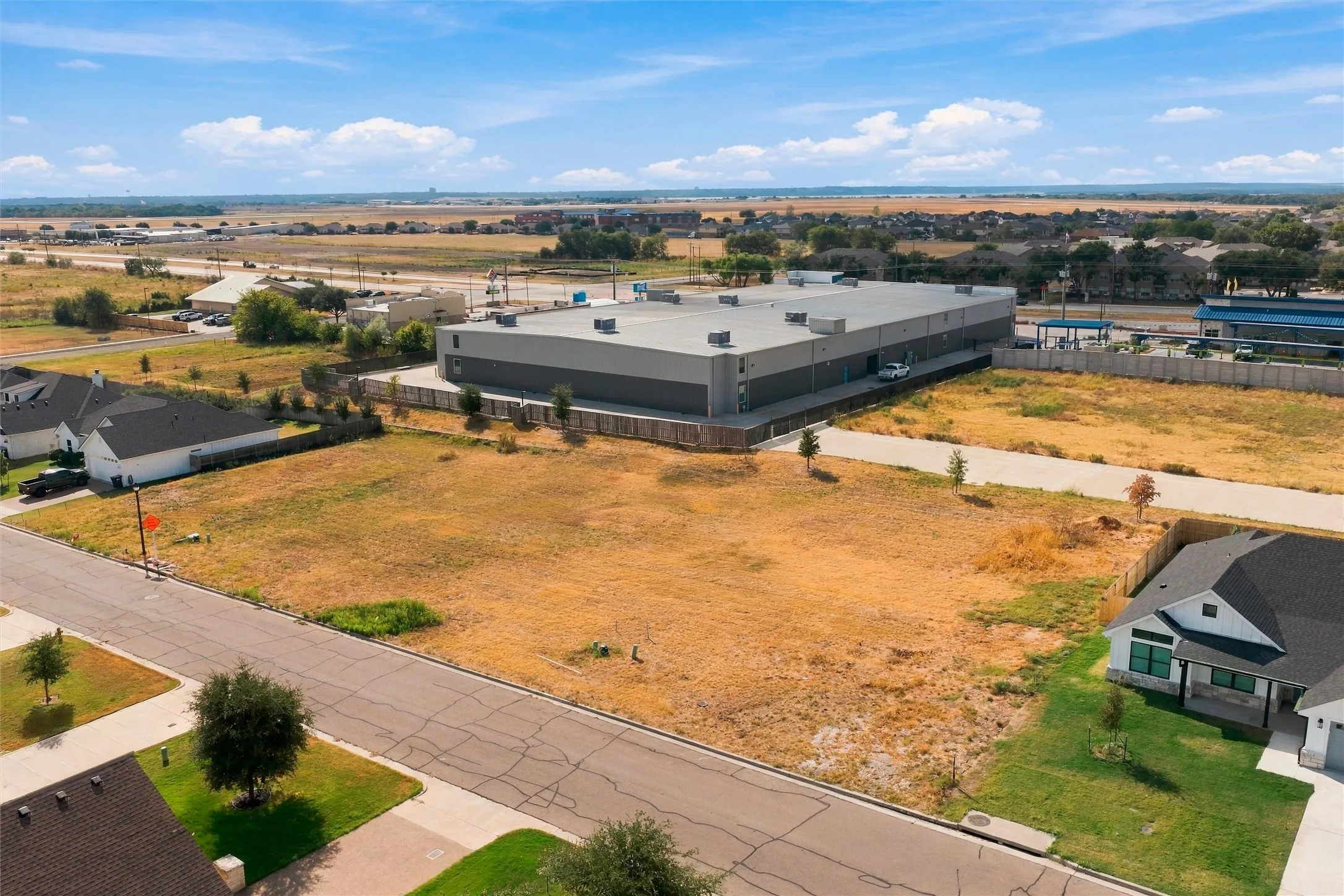 Expansive undeveloped land parcel with direct paved road frontage