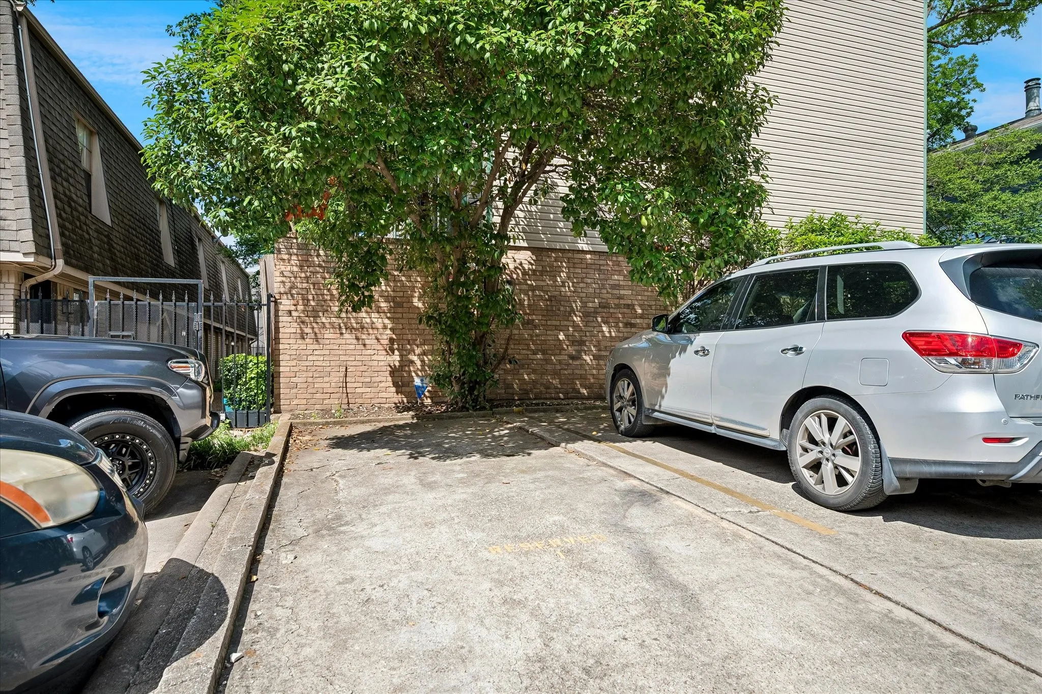 One parking spot in the front parking area and one carport spot!