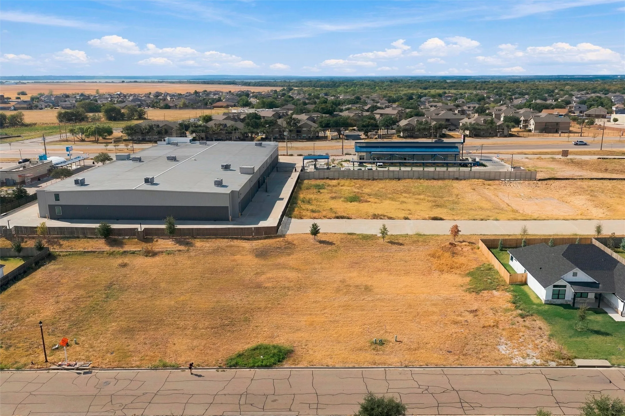 Expansive lot with adjacent commercial building and residential property