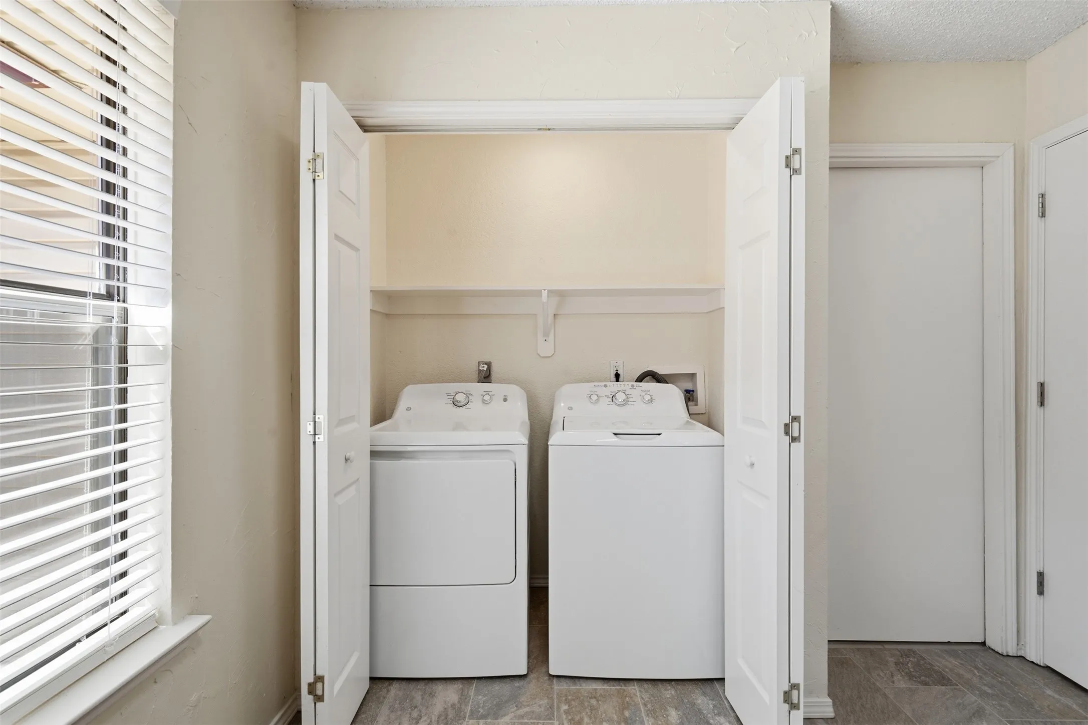 Dedicated laundry closet with bi-fold doors
