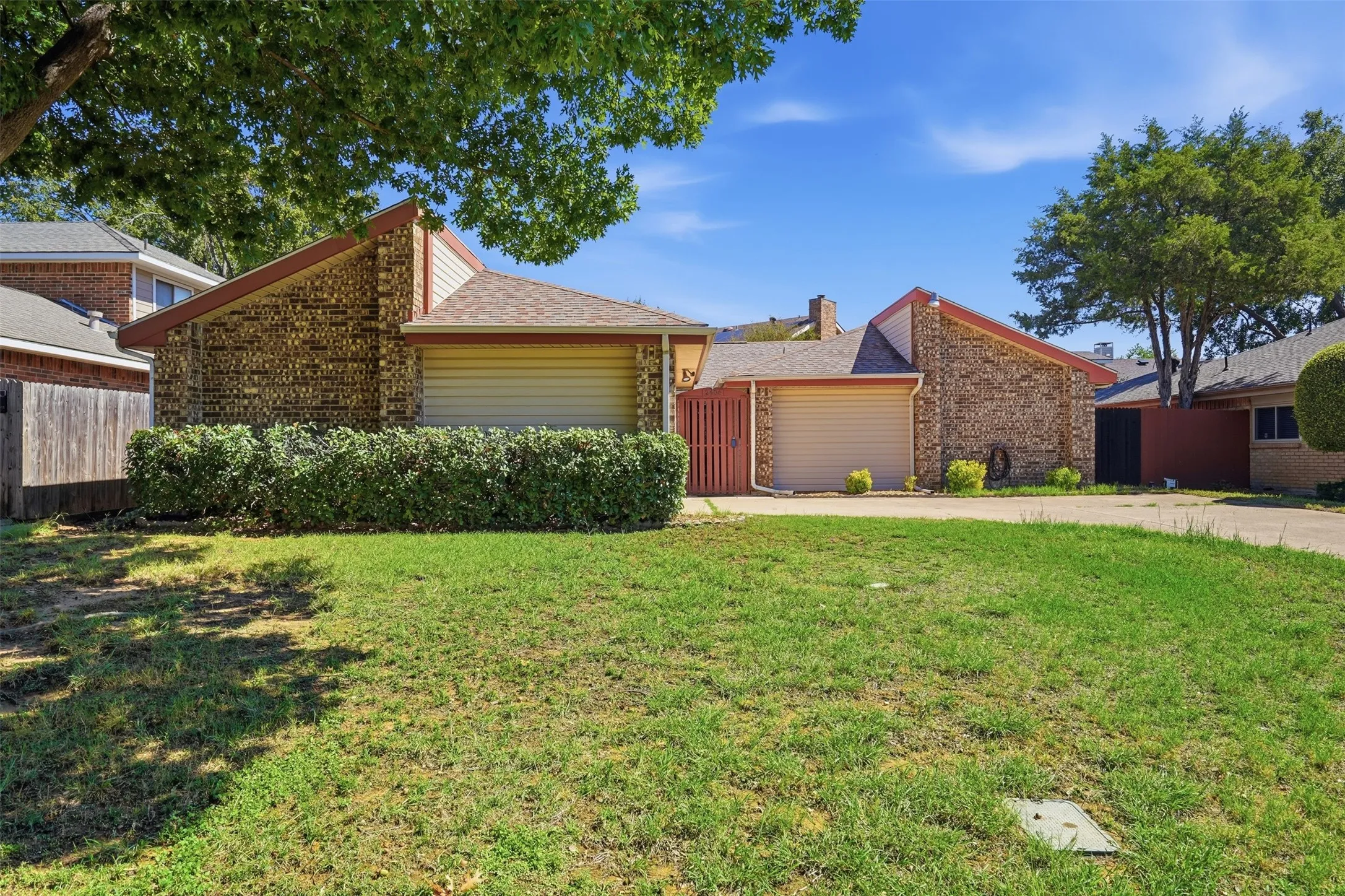 Brick and siding exterior with a pitched roof, featuring an attached garage and front​​‌​​​​‌​​‌‌​‌‌​​​‌‌​‌​‌​‌​​​‌​​ lawn