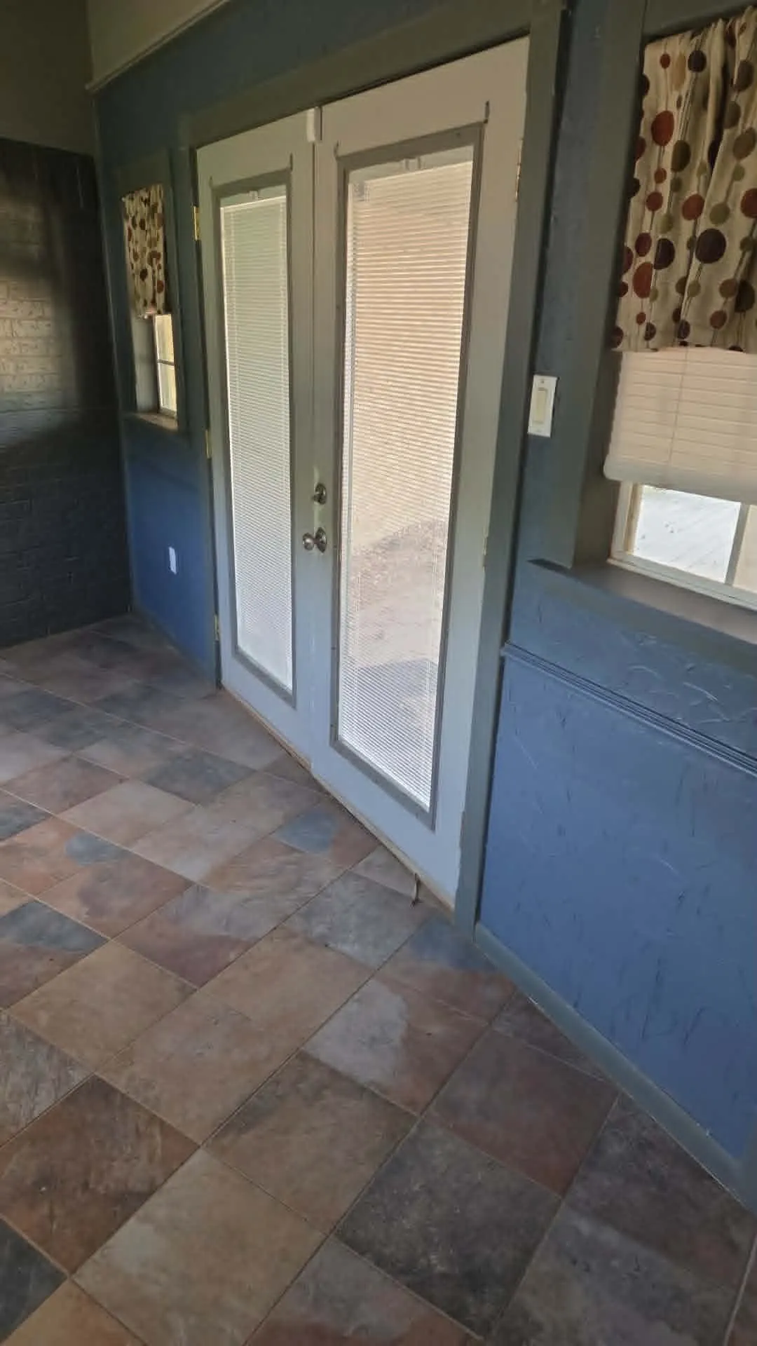 Entry between kitchen and converted garage