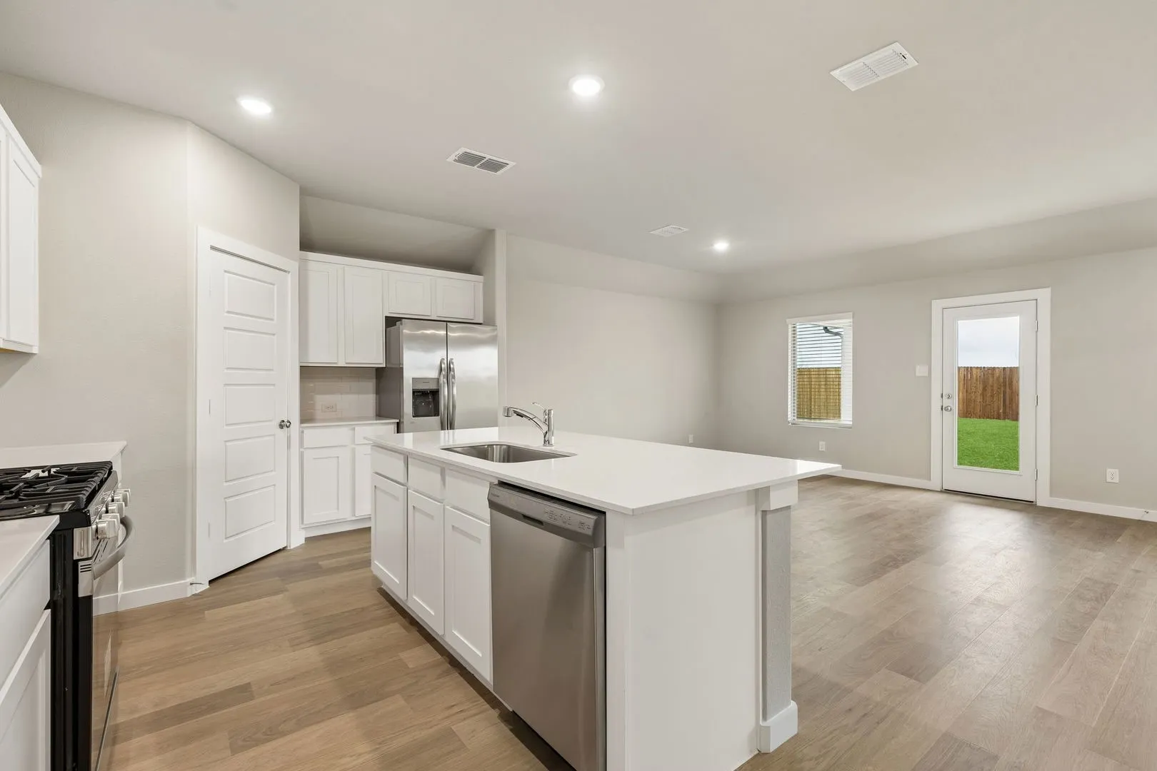 Kitchen in the Emmy II home plan by Trophy Signature Homes - REPRESENTATIVE PHOTO