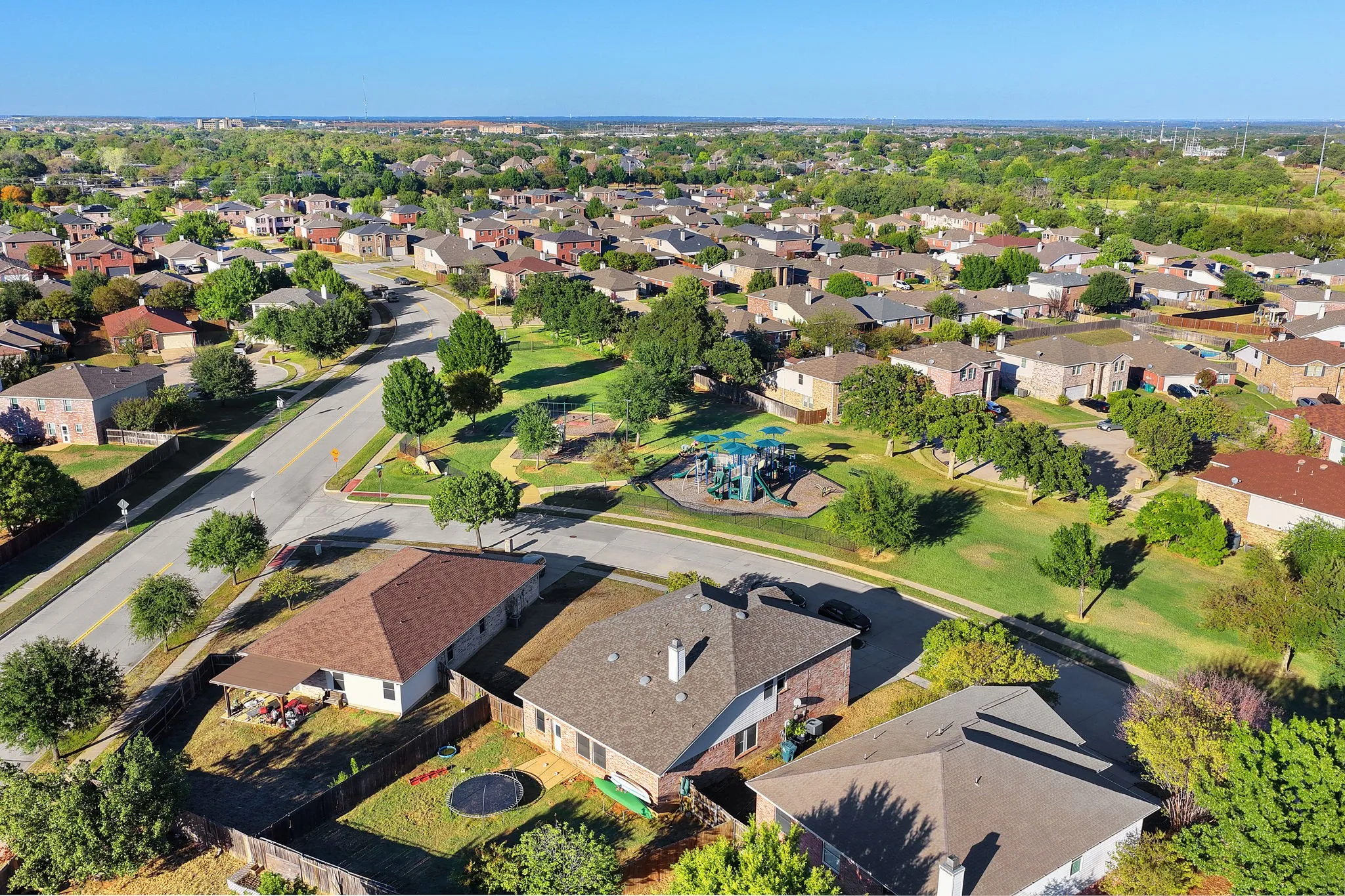 Residential neighborhood with varied rooflines and mature trees