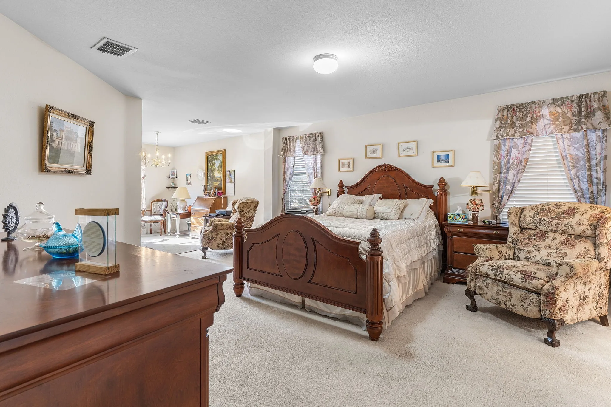 Carpeted flooring, vaulted ceiling, and recessed lighting