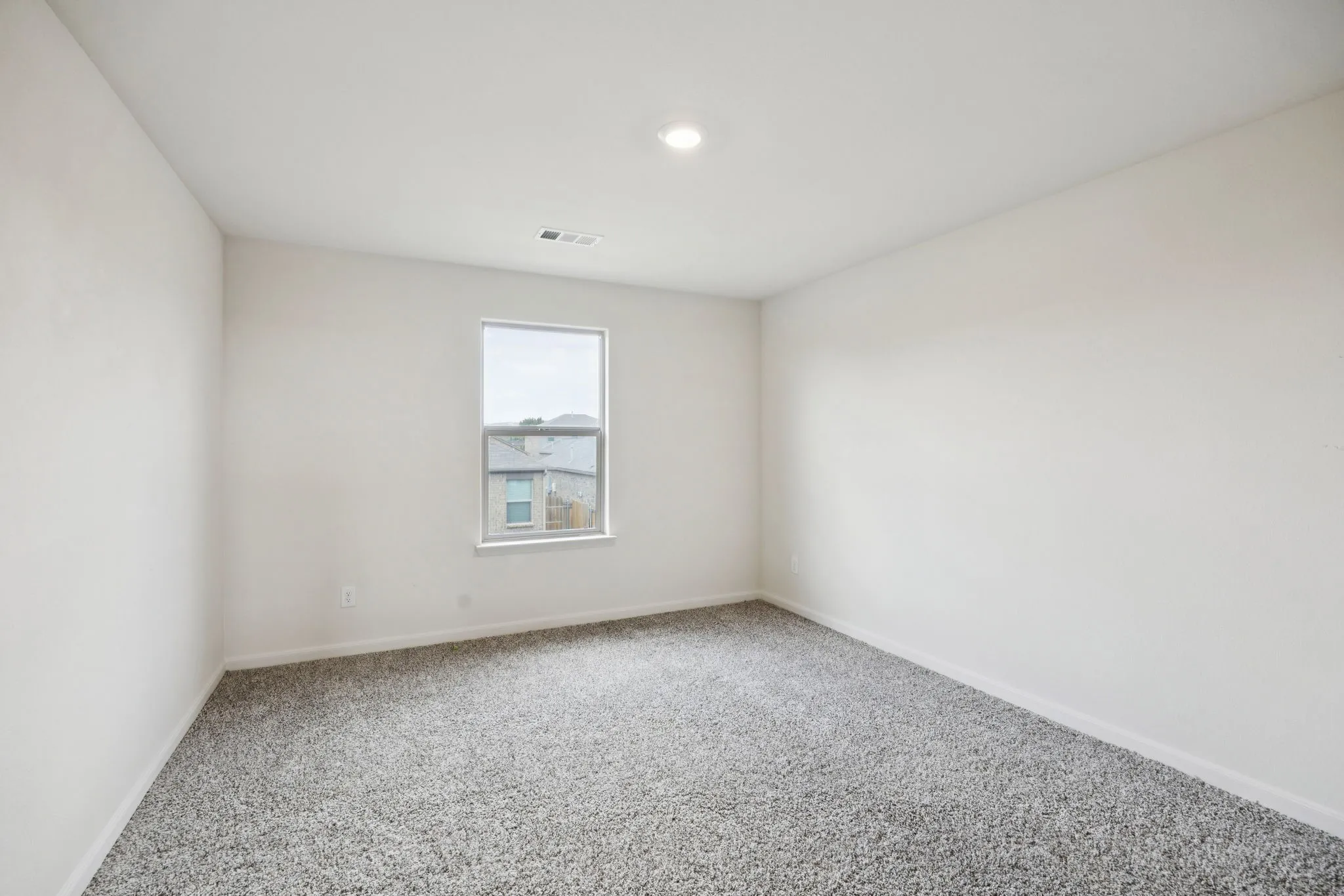 Carpeted flooring, single window, recessed lighting, and neutral wall color