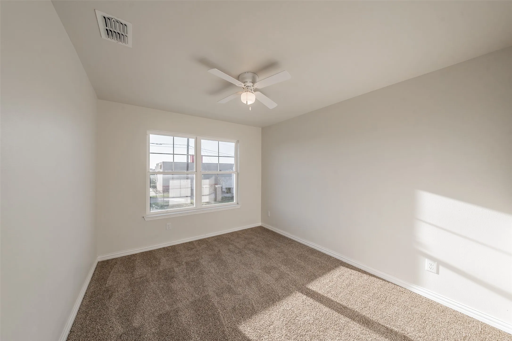 Bedroom 2 , has ceiling fan and plush carpet